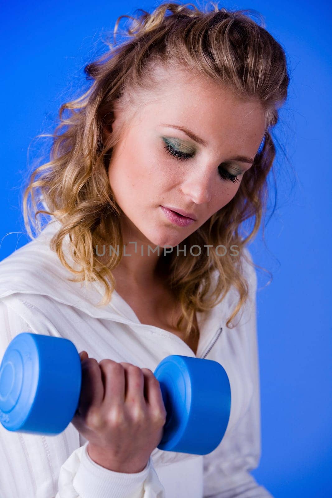 Woman doing dumbbell training II