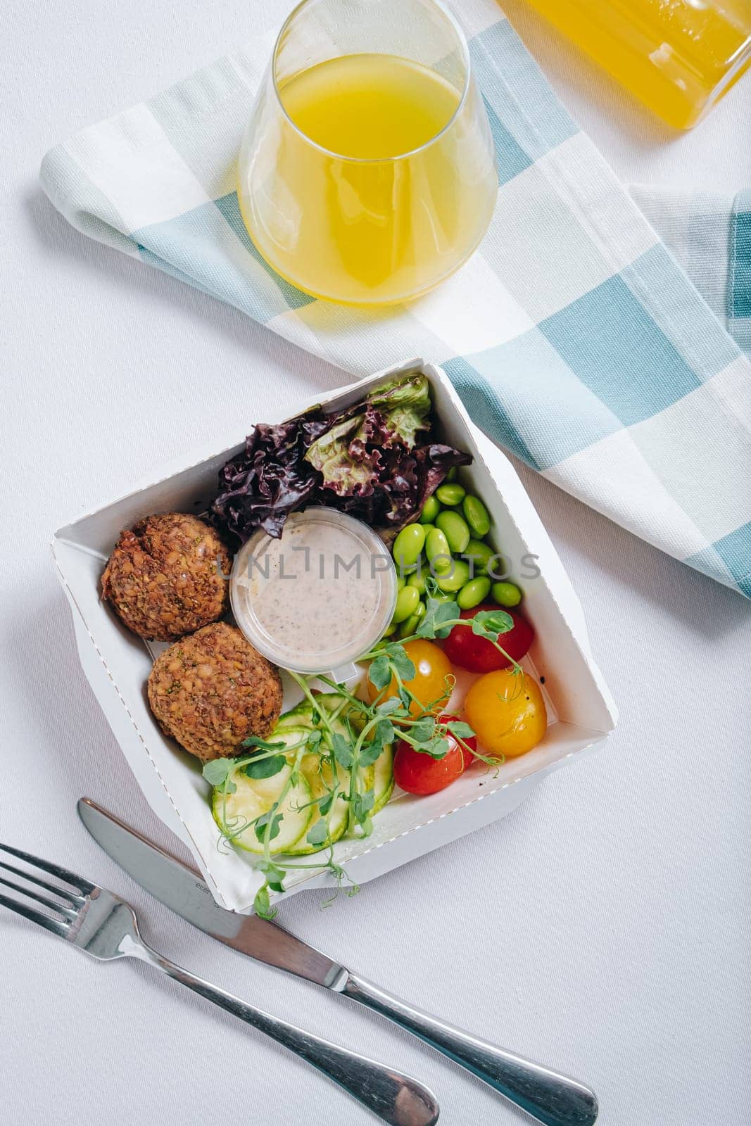 meatballs with beans, herbs, cherry tomatoes and sauce