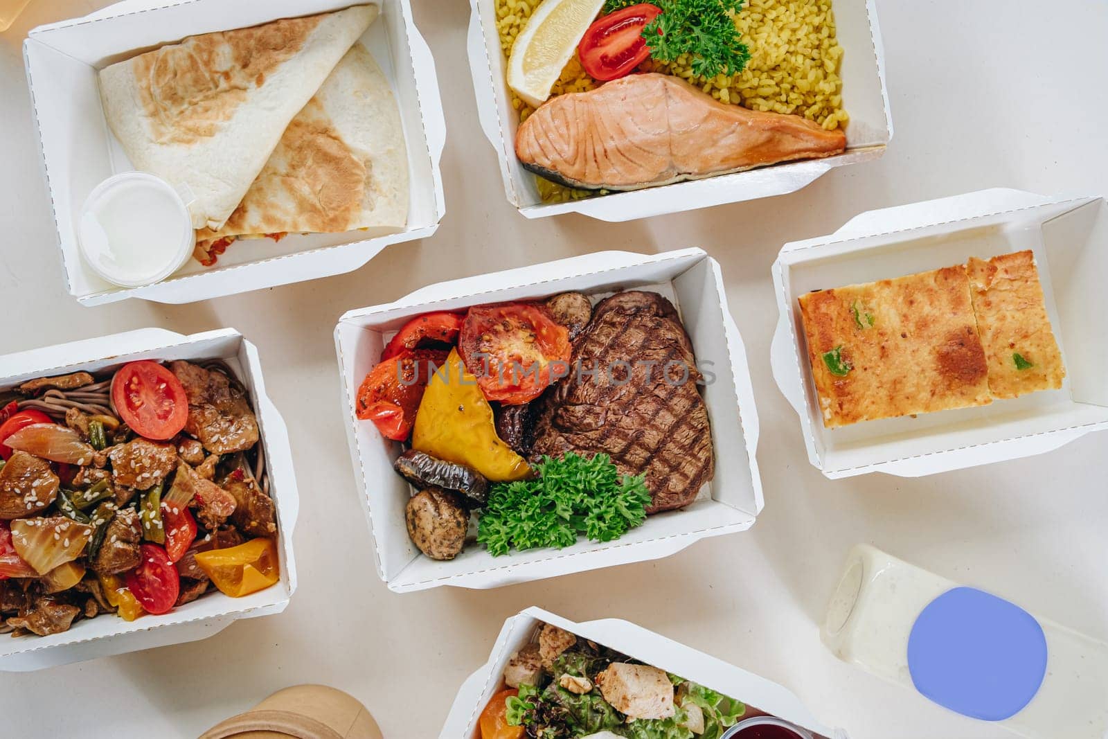 food in containers. proper nutrition, daily diet, weight loss. soup, drink, salad, steak.