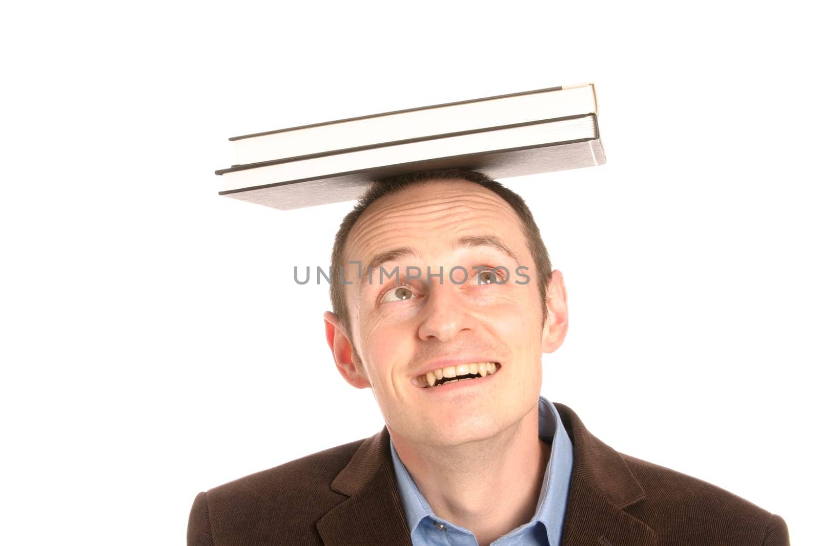 Man with stack of books on his head
