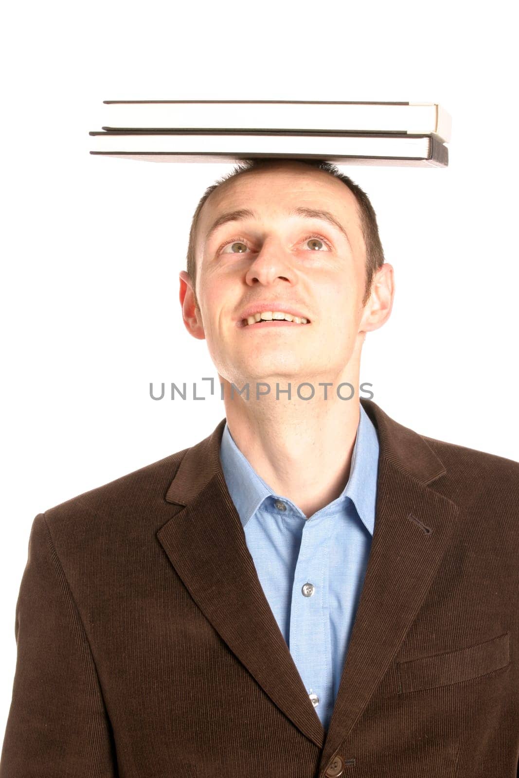Man with stack of books on his head