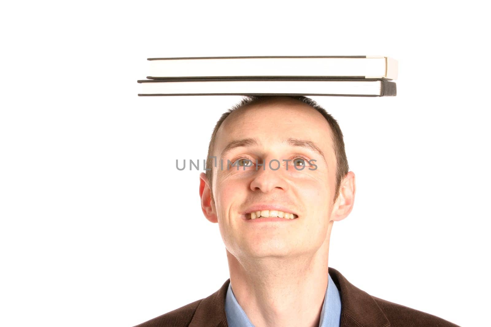 Man with stack of books on his head