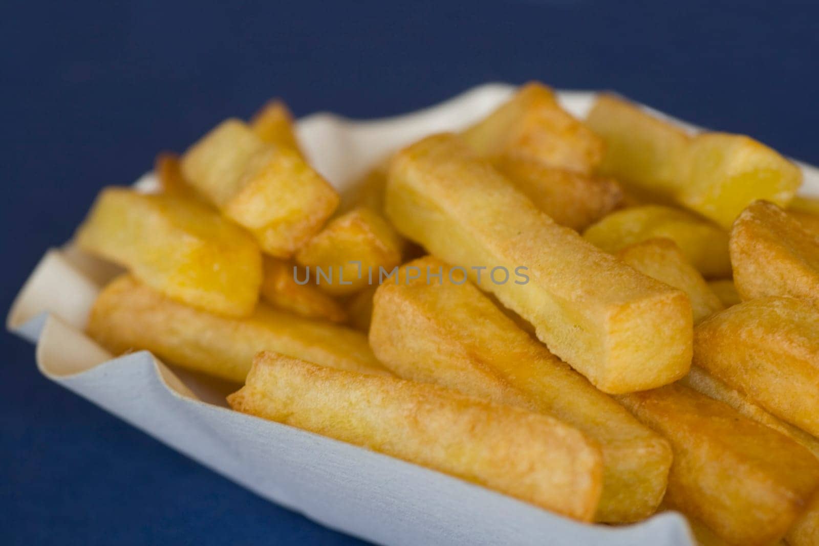 French fries on blue background