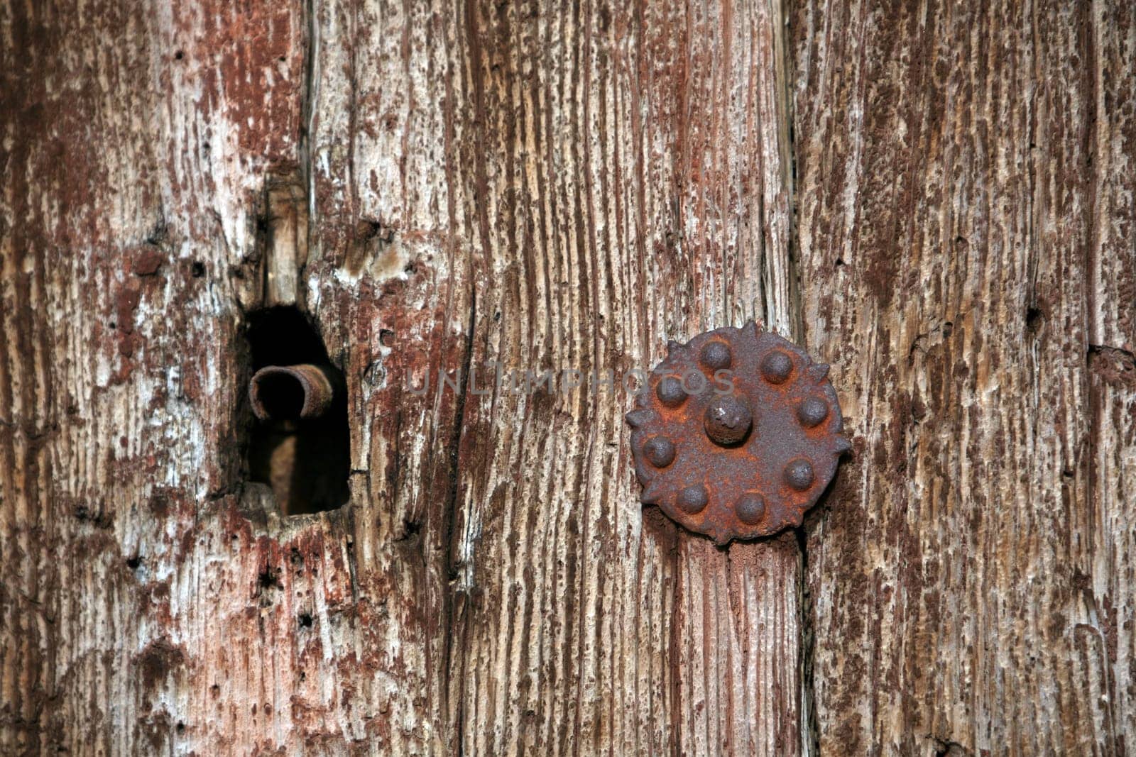 Keyhole in old wooden door