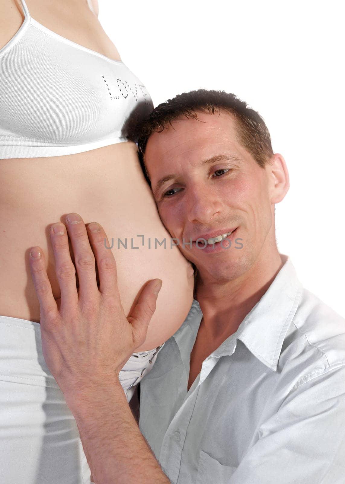 Father listens to his unborn baby