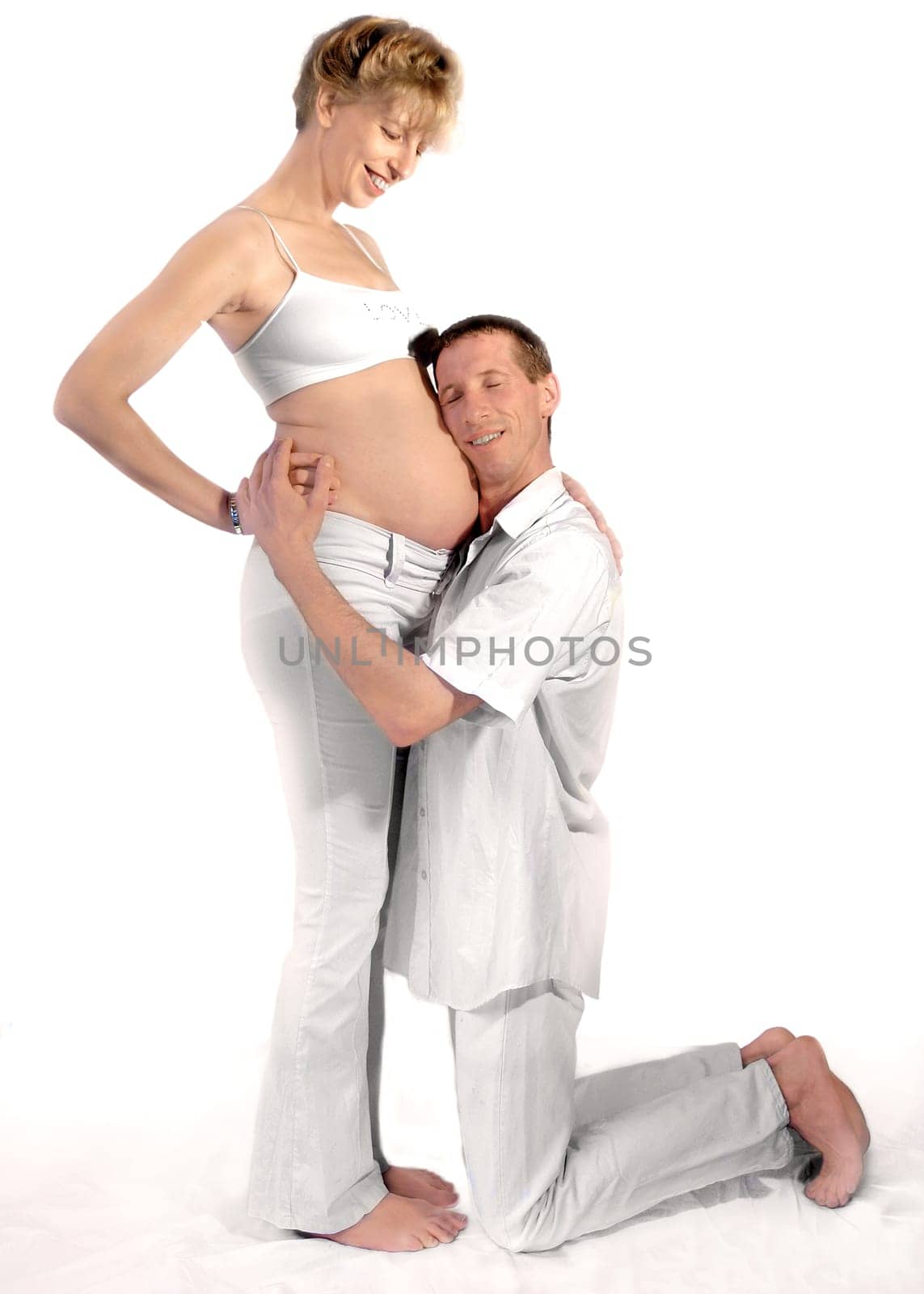 Father-to-be listens to baby