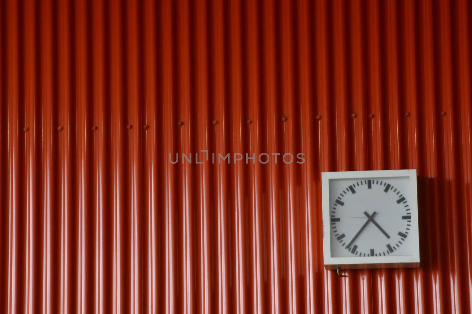 Clock on a red wall