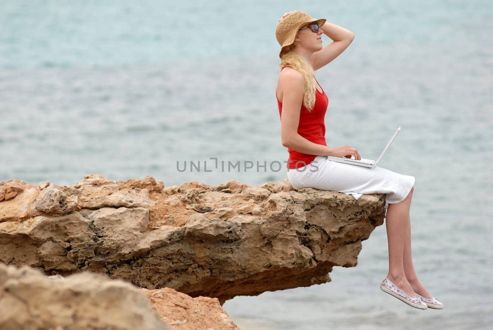 Young woman by the sea