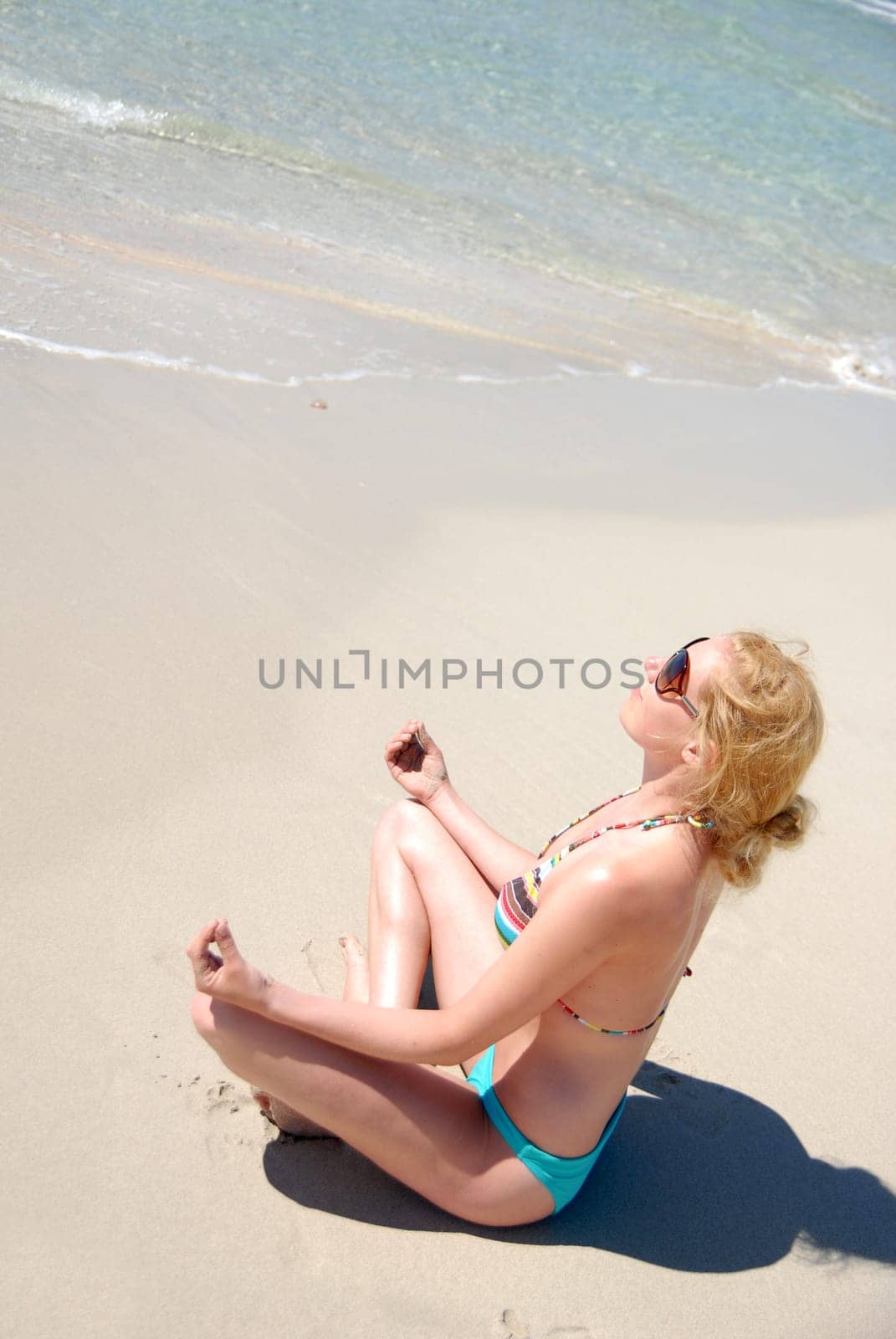 Woman relaxing by the sea