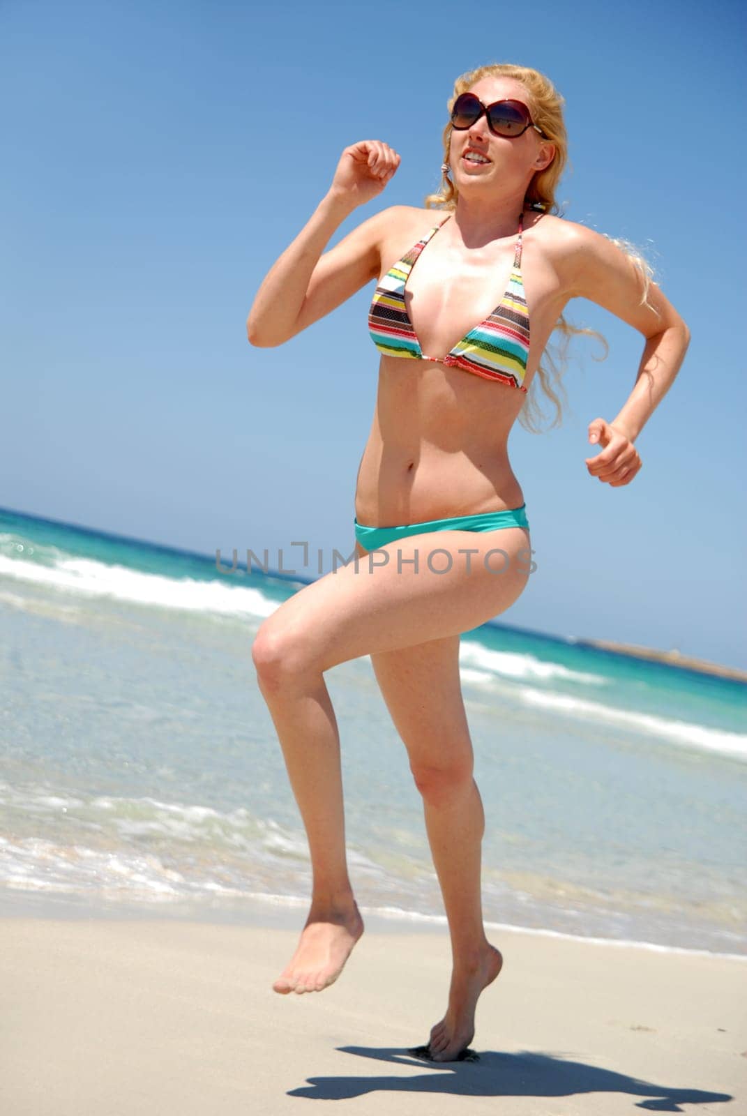 Woman running on the beach