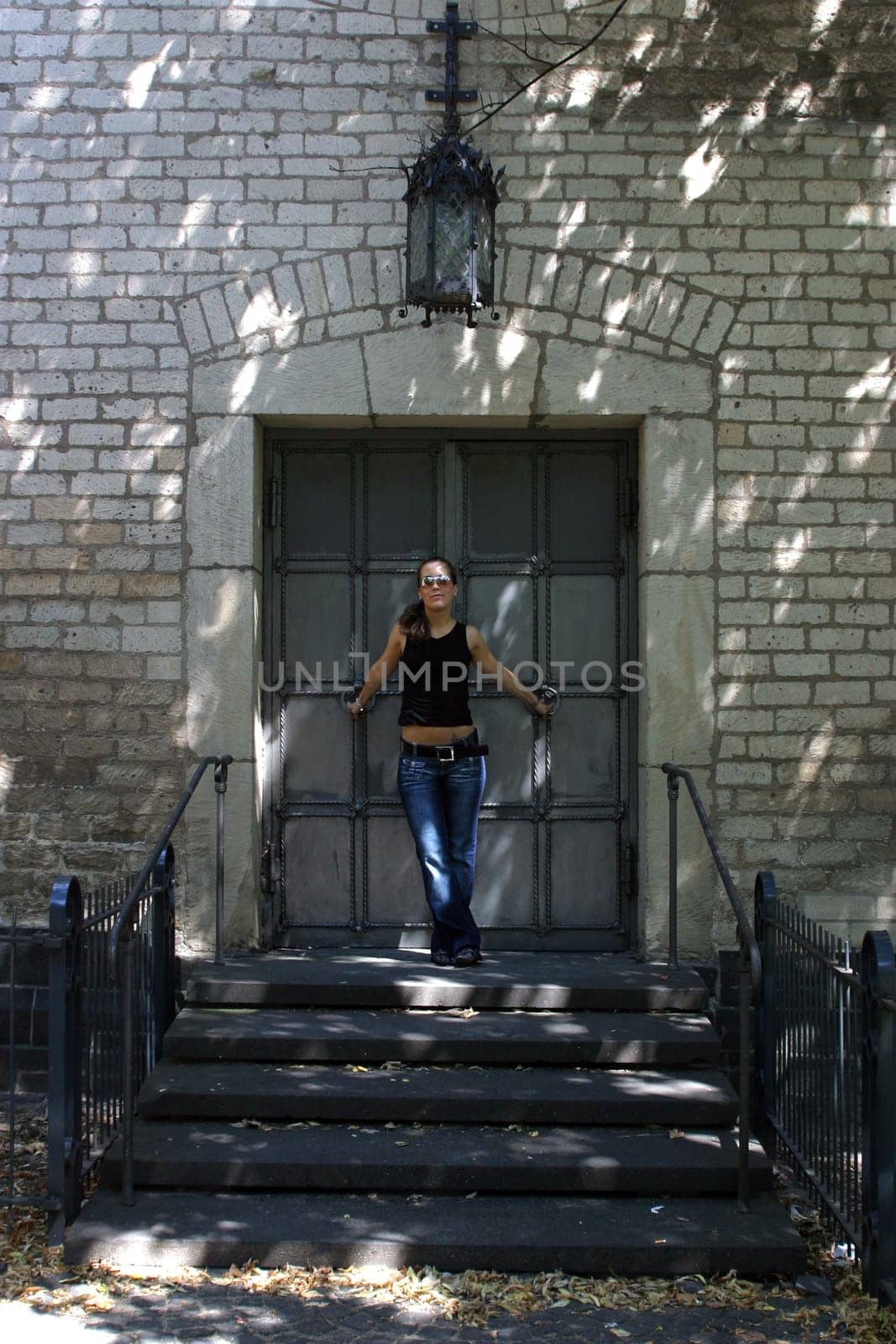 young woman in front of church portal