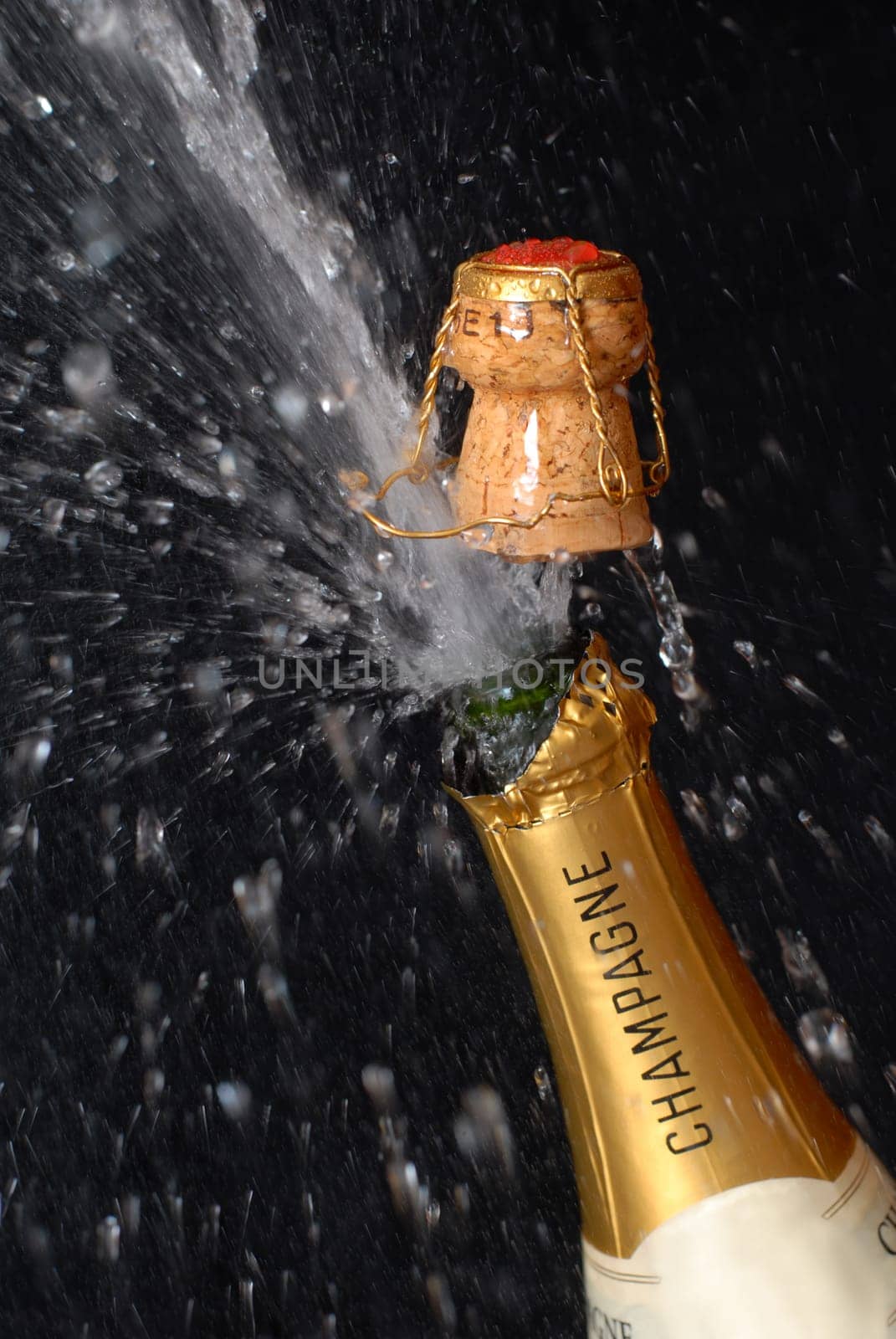 Popping champagne bottle