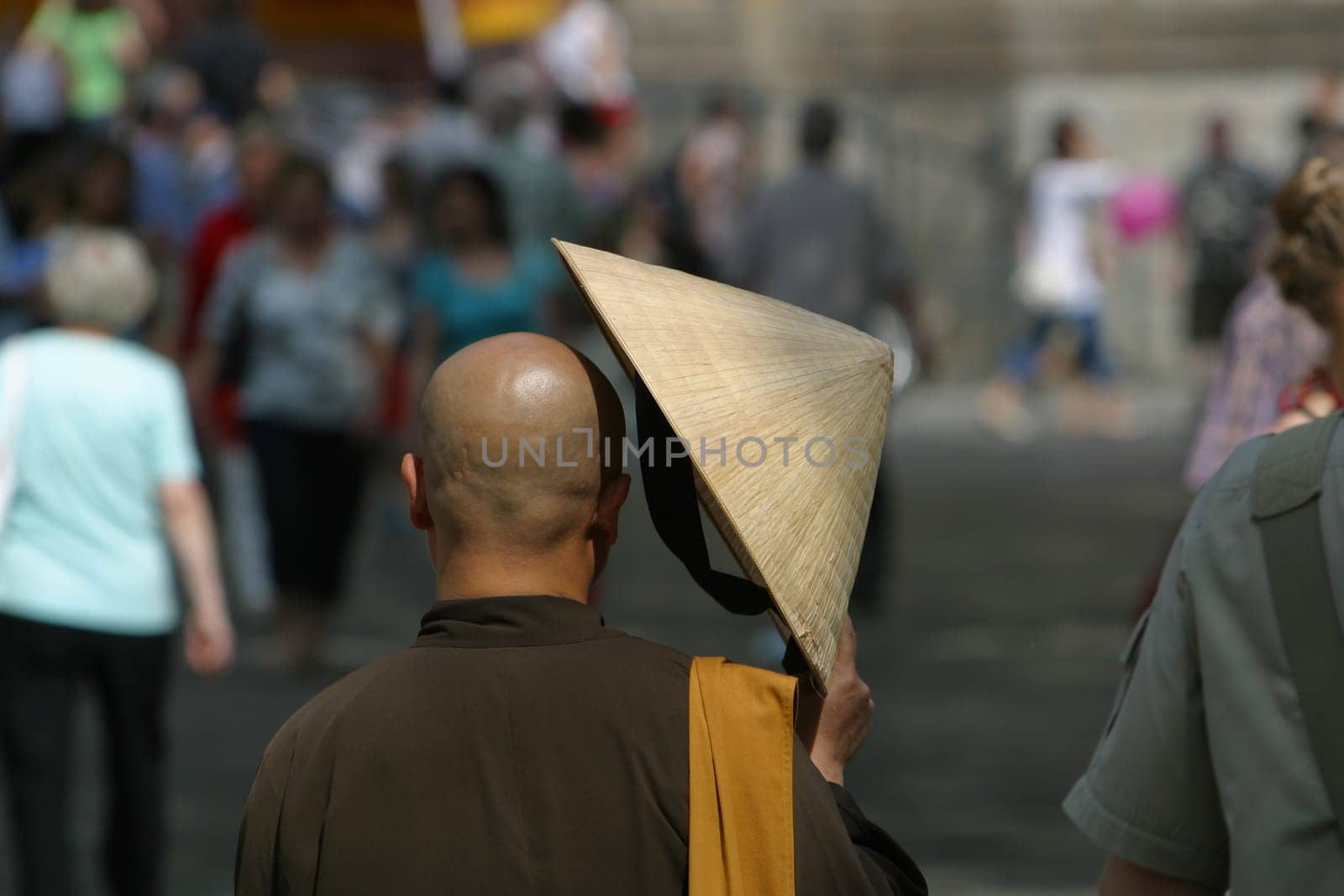 Asian monk with sunscreen