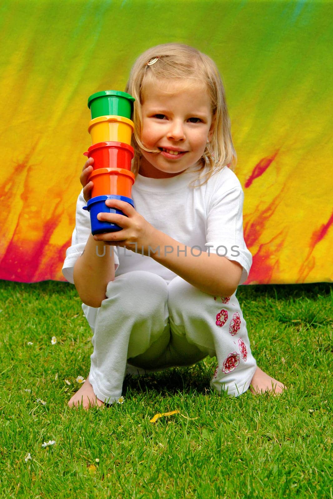 Little girl with paint pots
