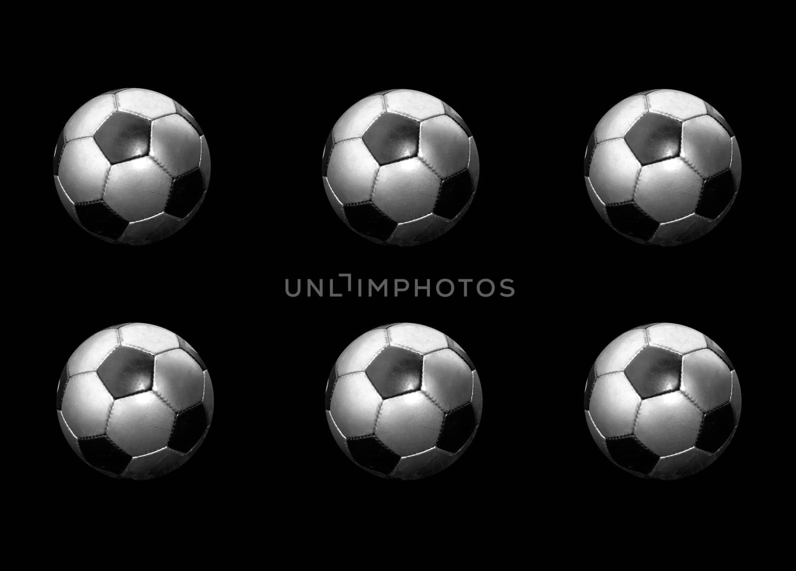 6 silver footballs on black