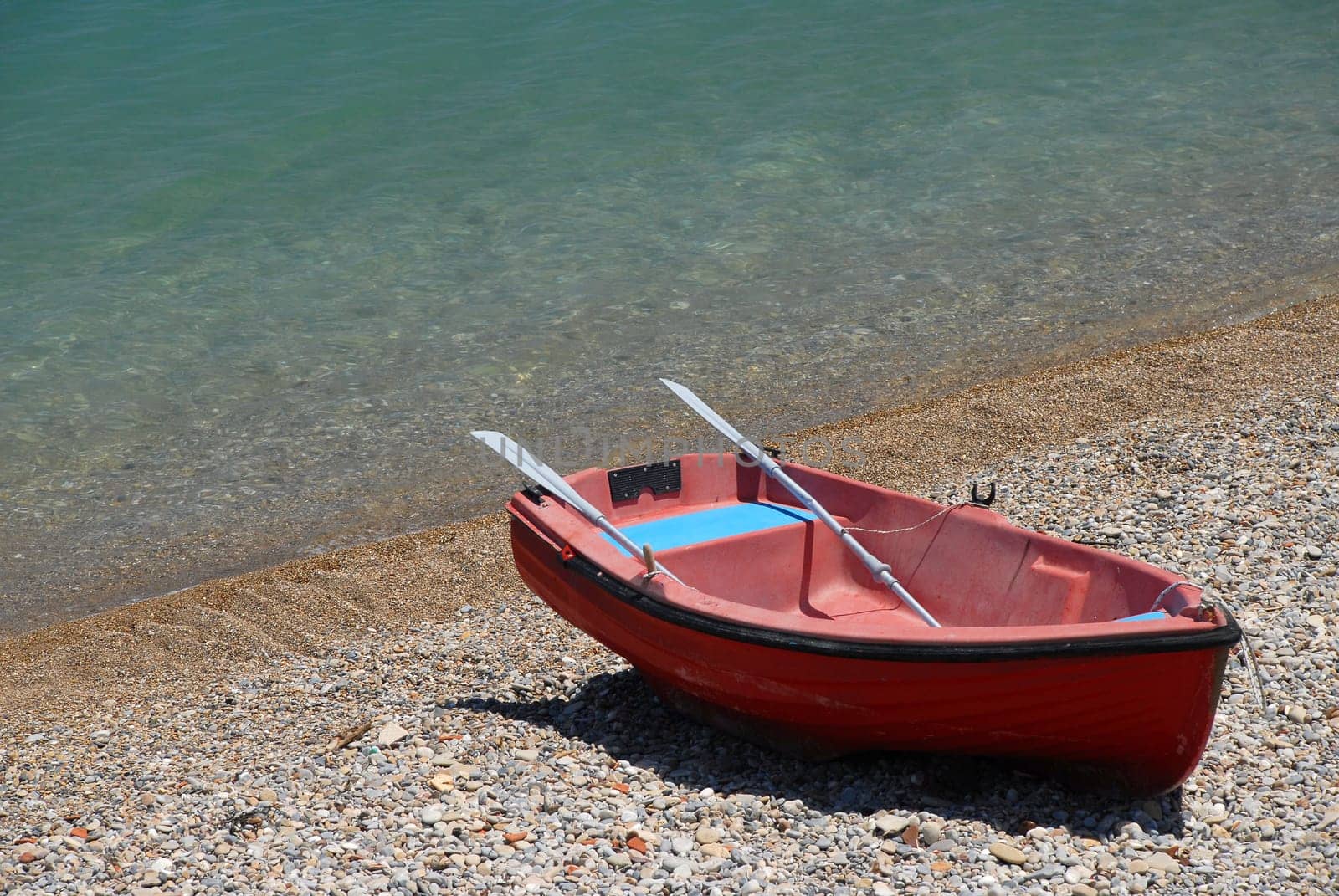 red boat on the beach