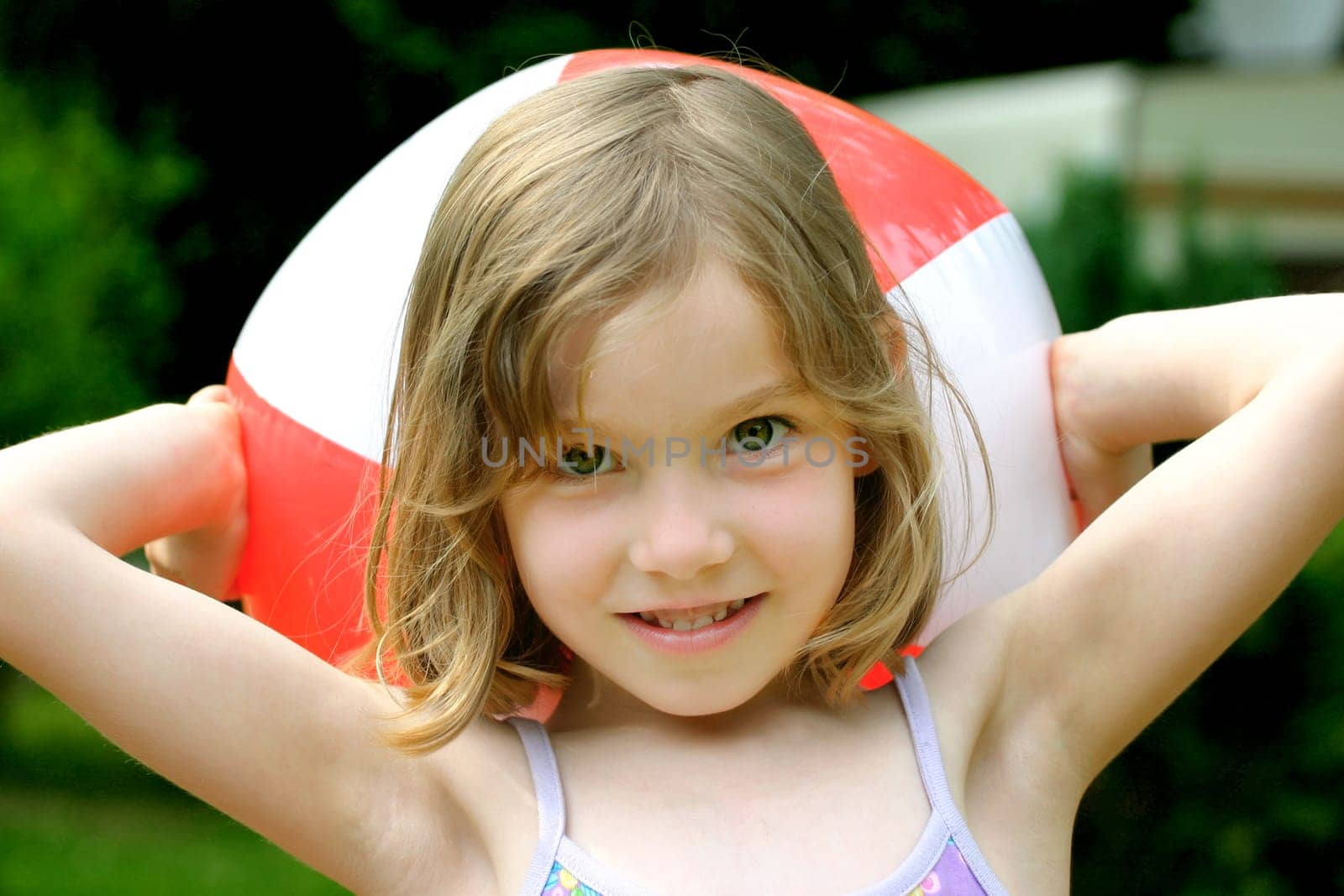 Girl in summer with a beach ball