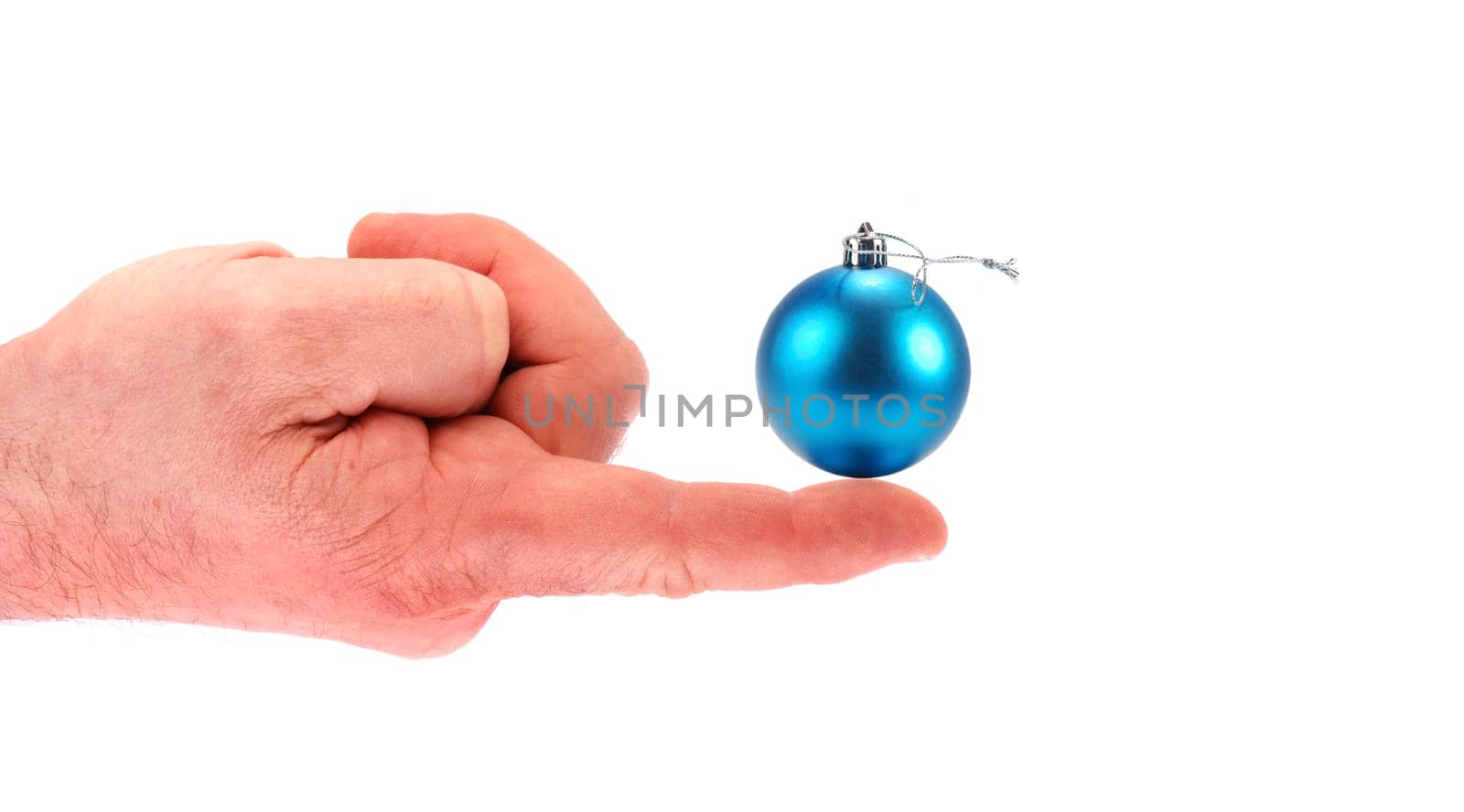 Christmas tree bauble at your fingertip