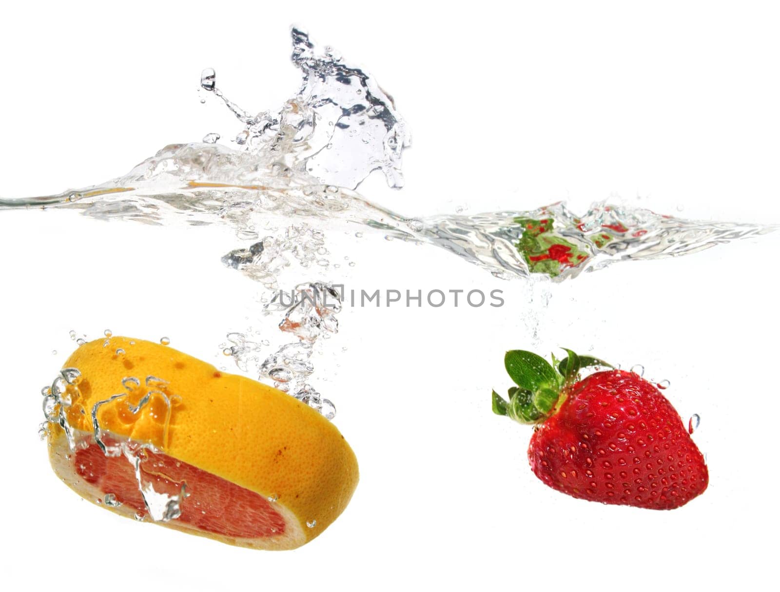 Strawberry and grapefruit in water