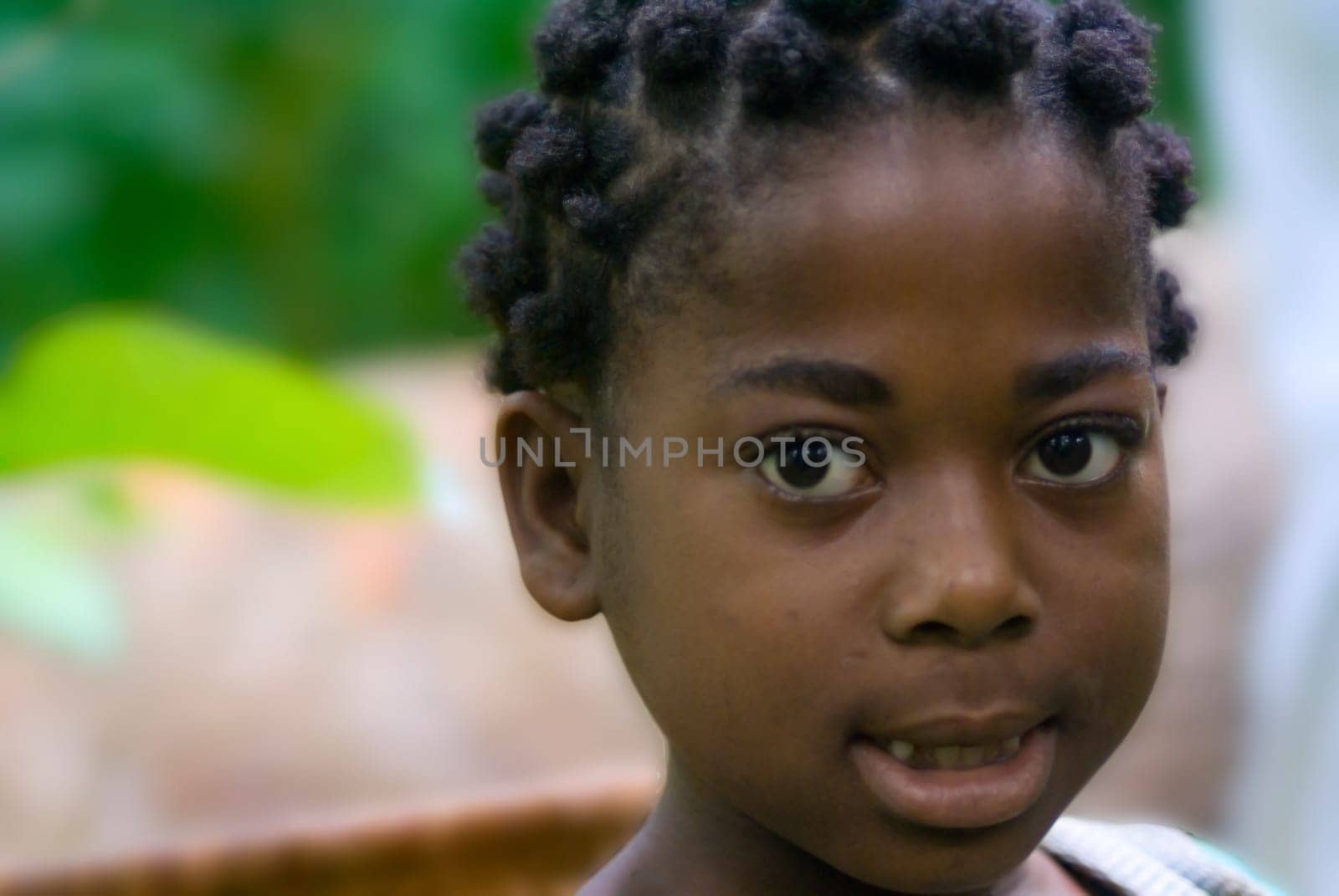 Marie Lise is the daughter of Madame Eloundou and she also has to help carry bananas,but her collar is not that big. She is a very bright girl.... she wants to become a doctor one day,with her great school performance she is on the best