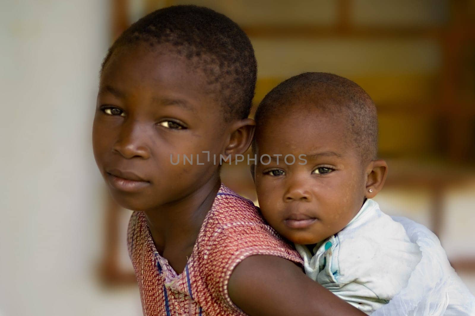 ... what is your future. The sister piggybacks on her brother,two children from an African village. The picture doesn't want to be early,it's rather sad.... Children of Africa,what is your future? Don't you also have the right to a future and a future?