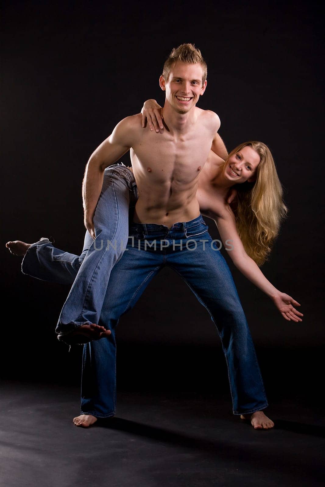 Couple with jeans having fun