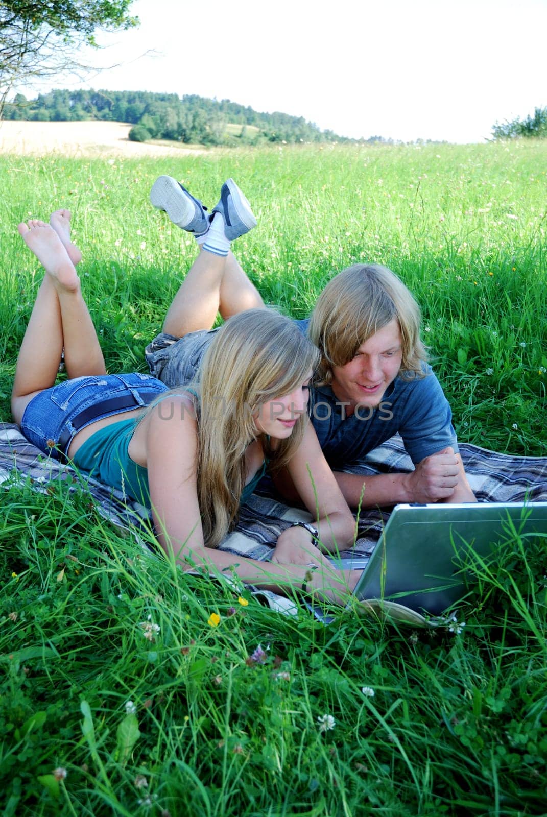 Young couple using laptop