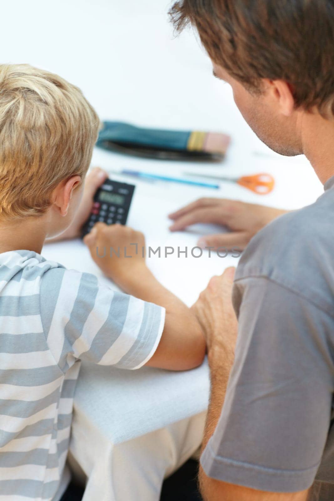 Learning, math and father help child with homework or homeschool as education and development in a home. Calculator, parent and dad support or teaching kid to count, numbers and studying for exam.