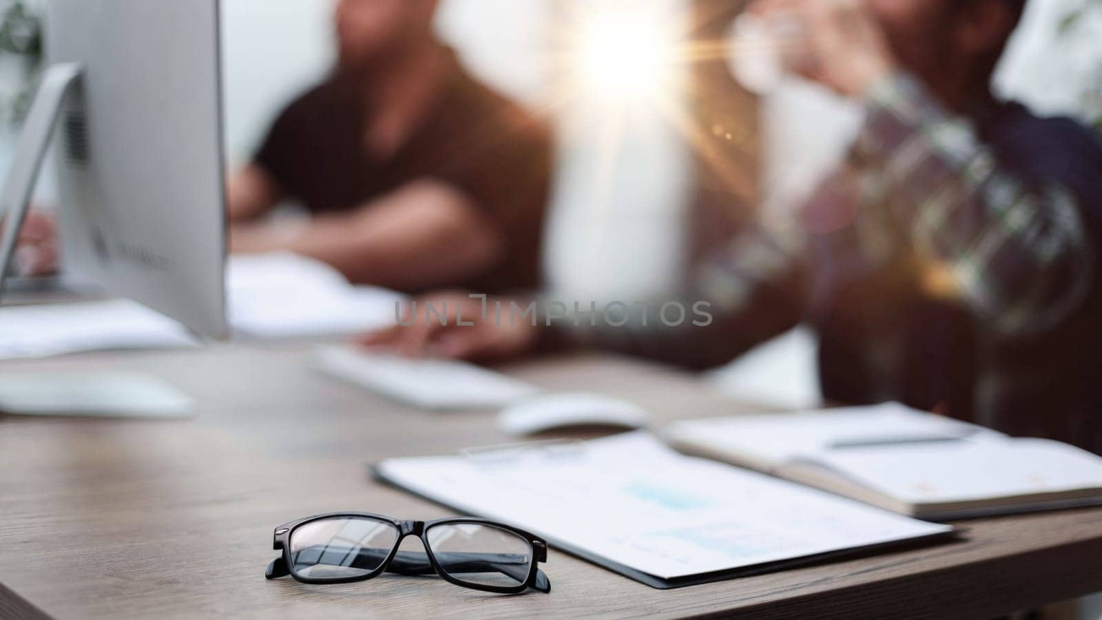 Close-up of male hands typing on laptop keyboard