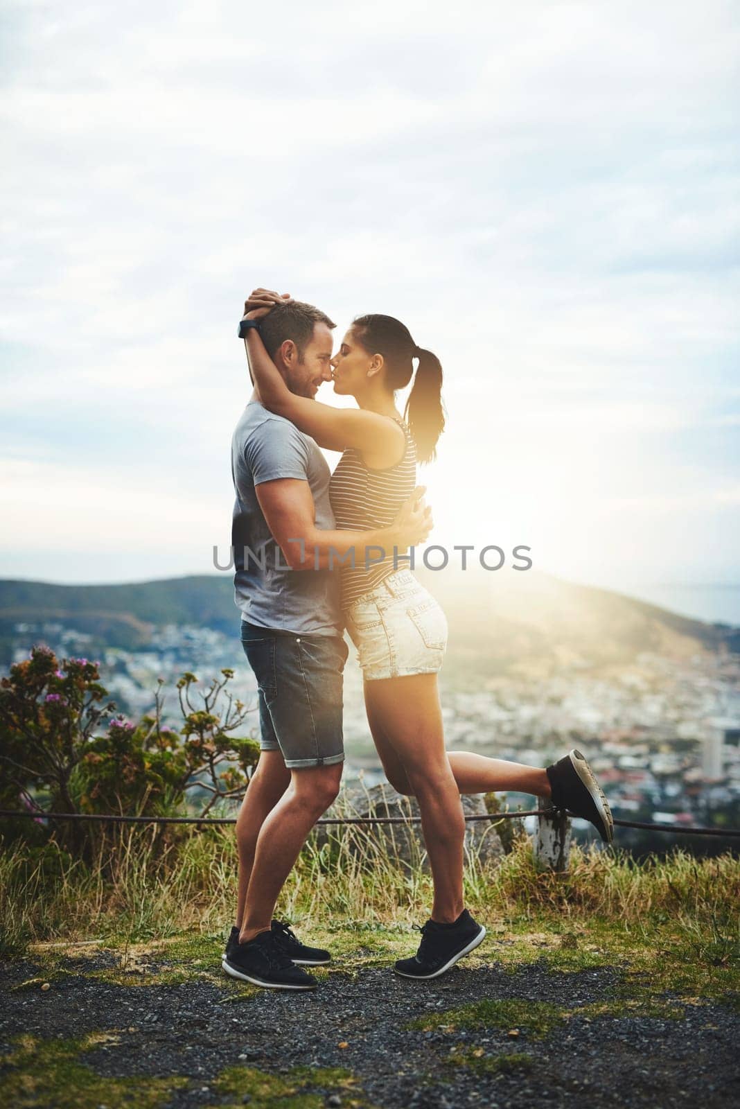 Kiss, mockup or happy couple hug in nature on outdoor date for love with support, loyalty or freedom. Romantic man, affection space or woman on holiday vacation together to relax or travel in USA.
