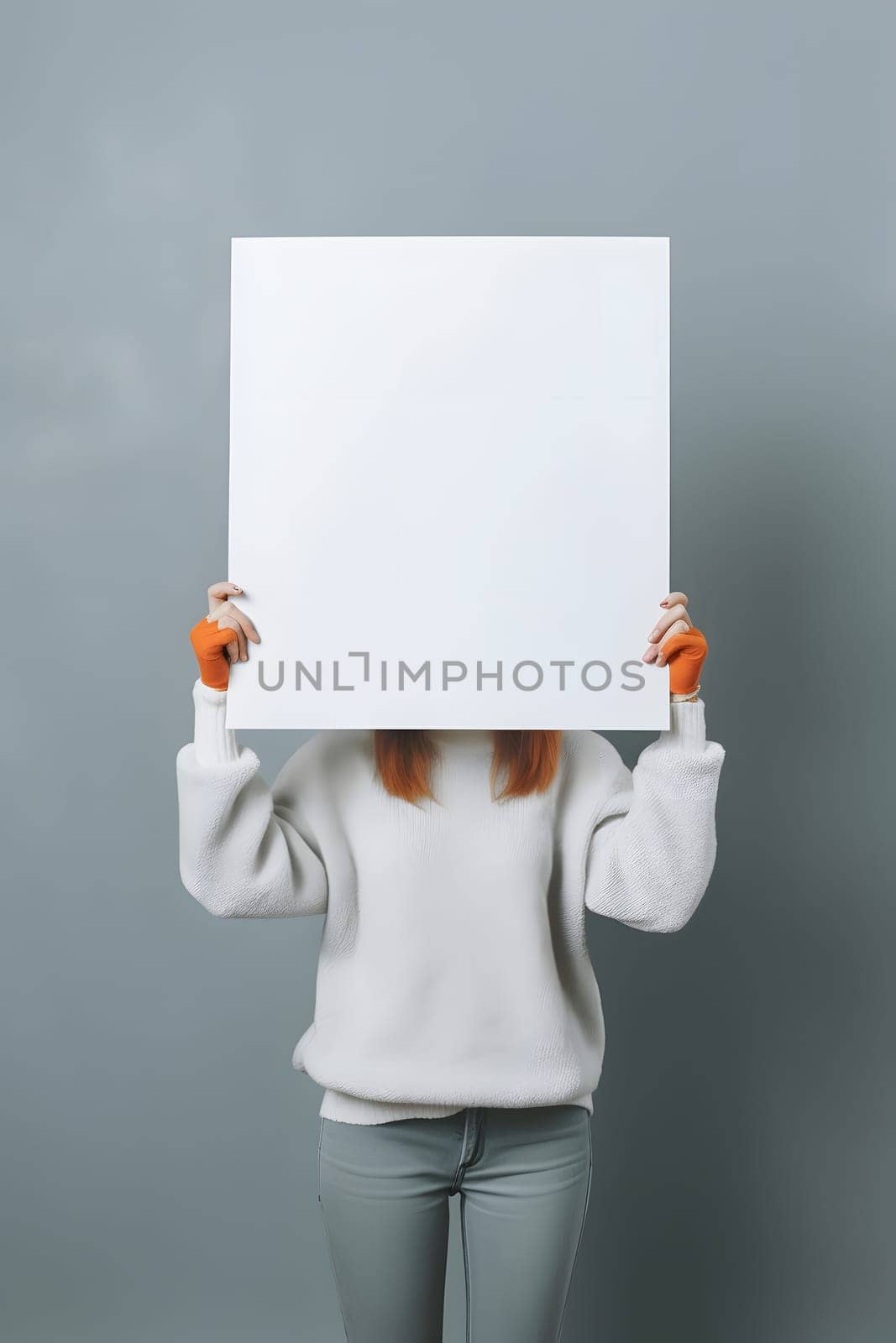 woman holding a blank sheet of paper on grey background. Neural network generated in May 2023. Not based on any actual person, scene or pattern.