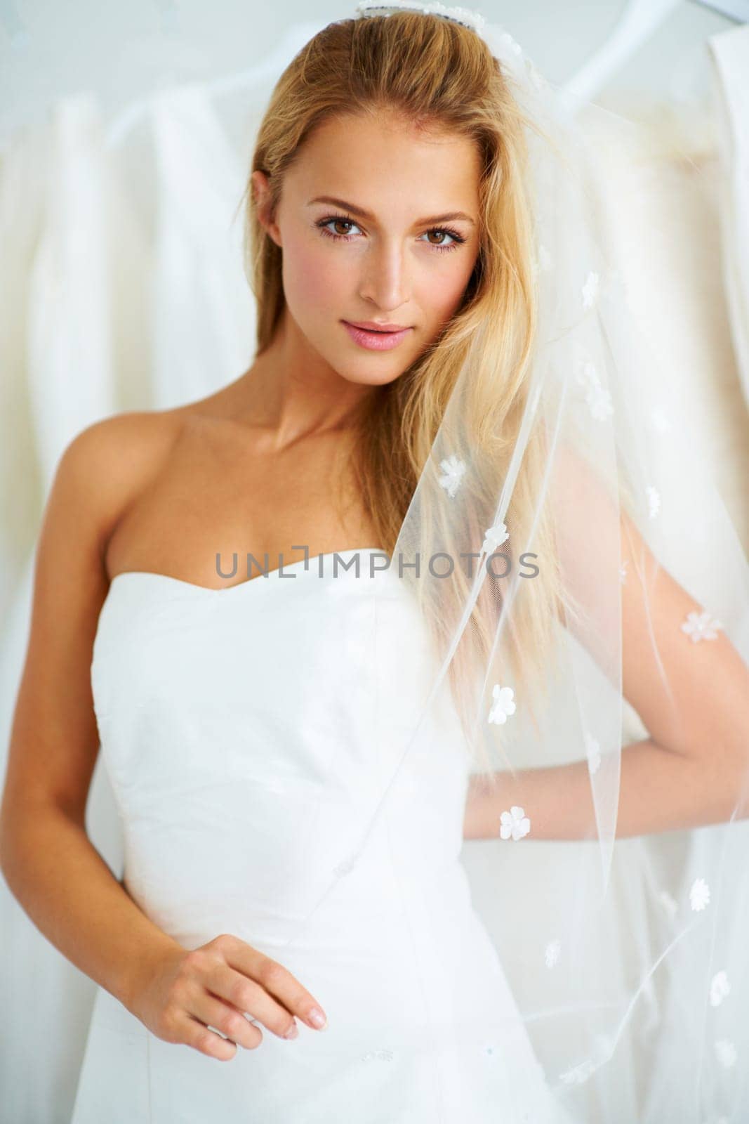 Wedding, portrait and young bride in a dress in a luxury boutique, shop or store in a mall. Retail, romance and female person from Canada preparing for marriage ceremony, party or reception for love