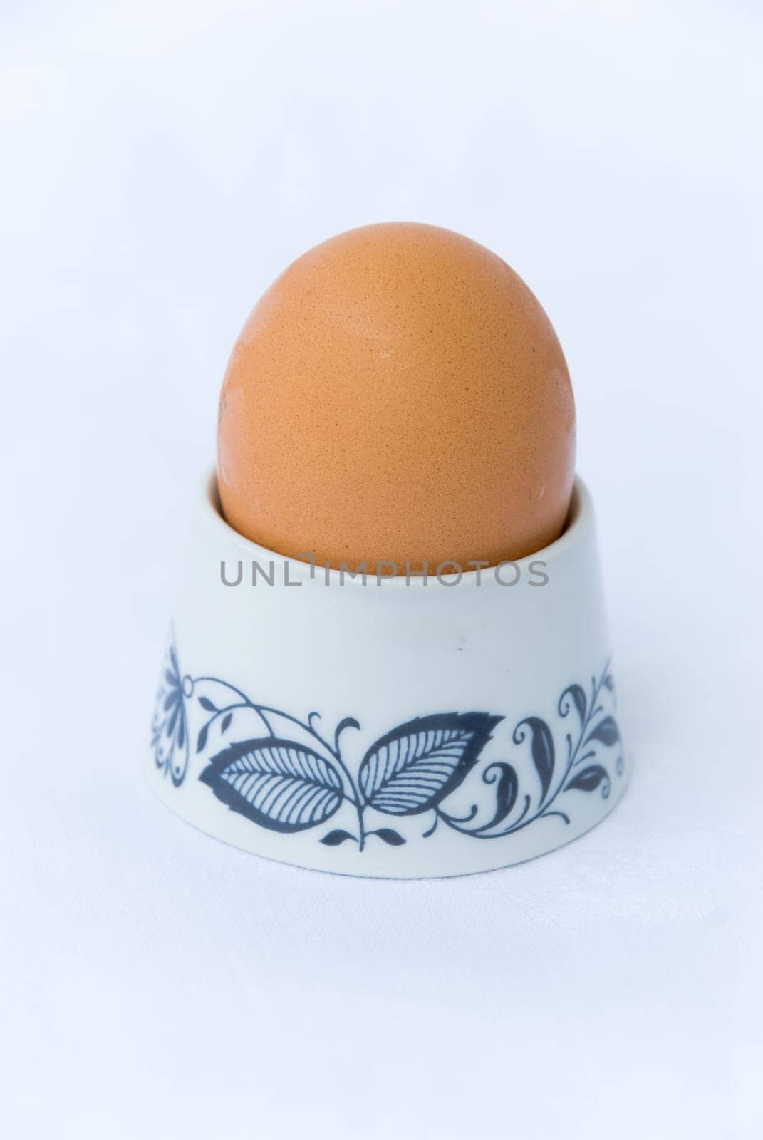 Boiled egg in egg holder