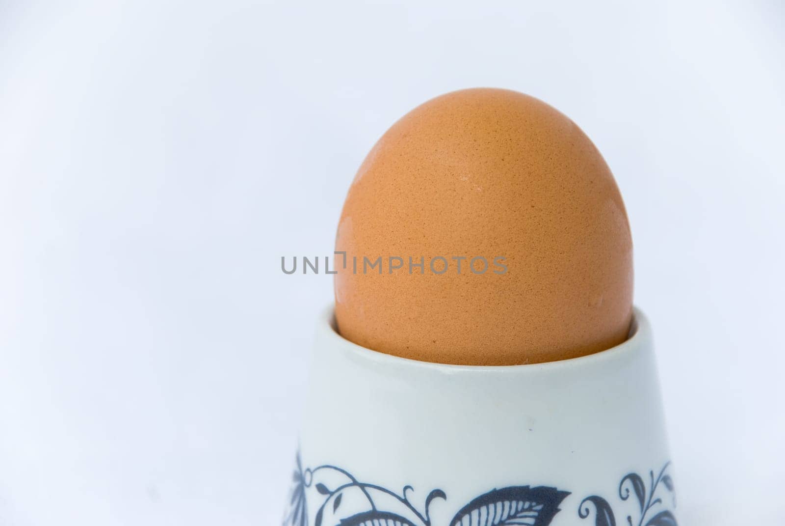 Boiled egg in egg holder