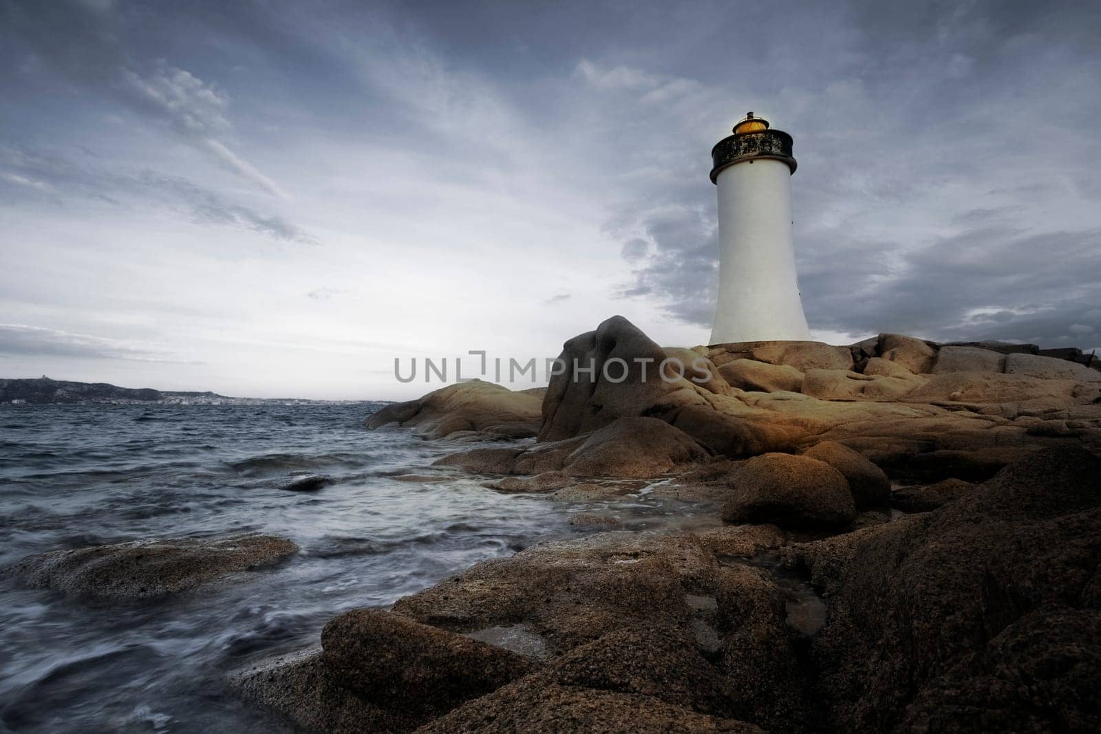 Lighthouse seen from a small street