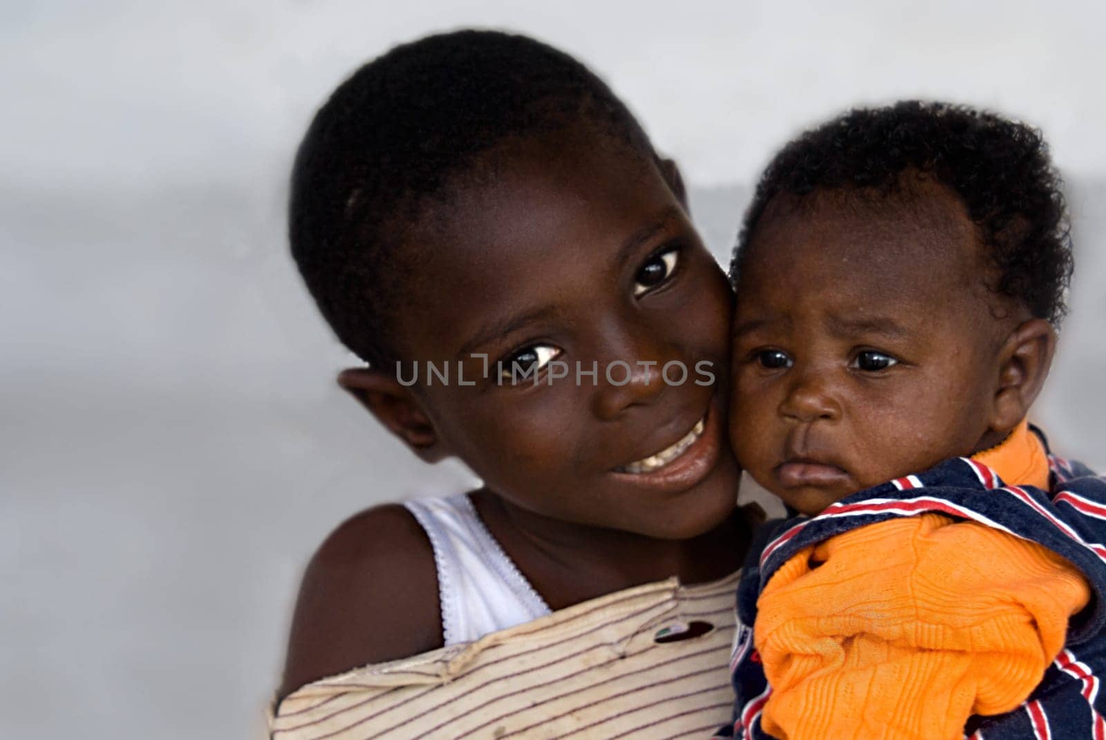 ... in the villages of Cameroon,it is the siblings who take care of and protect the small children,more than the mother,who is usually busy with hard work. It is touching to see how the older siblings take care of the babies and how they are able to take care of them.