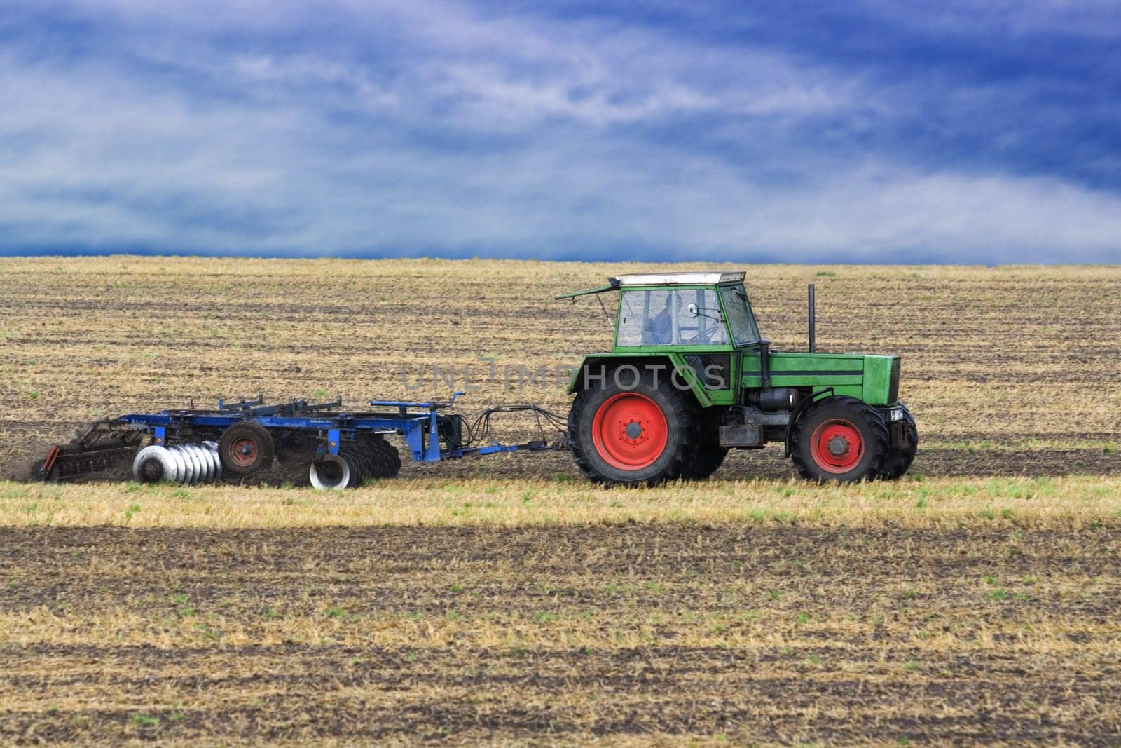 Tractor harrowing