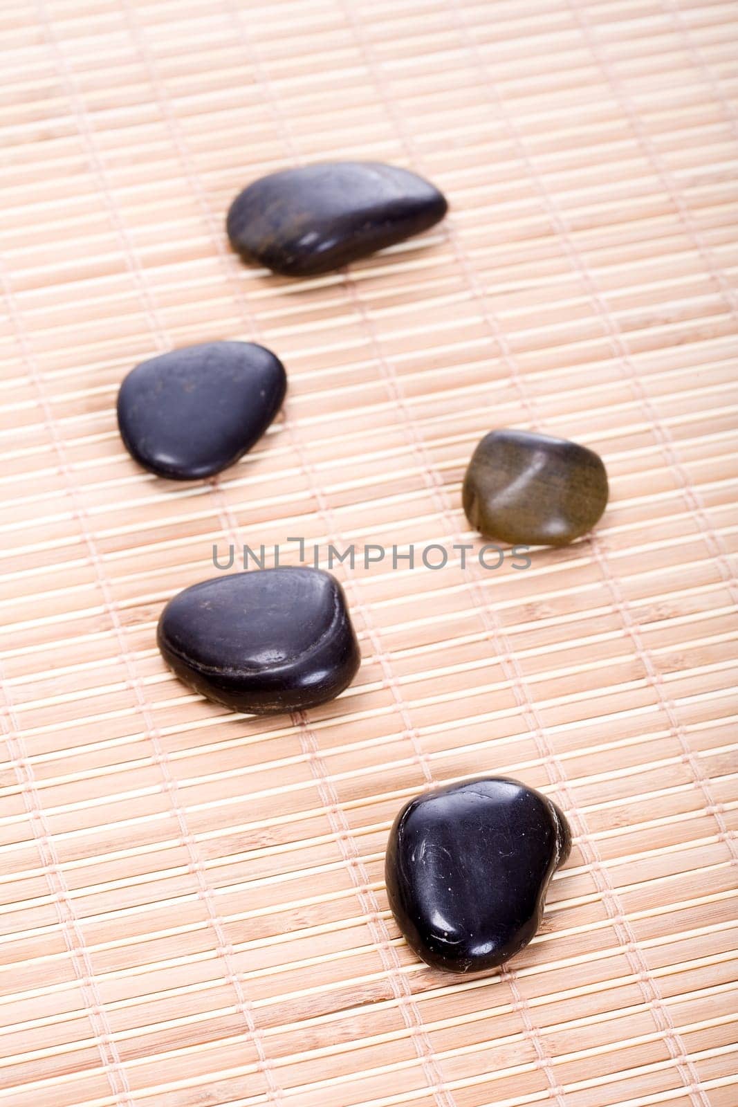 Zen stones on bamboo mat