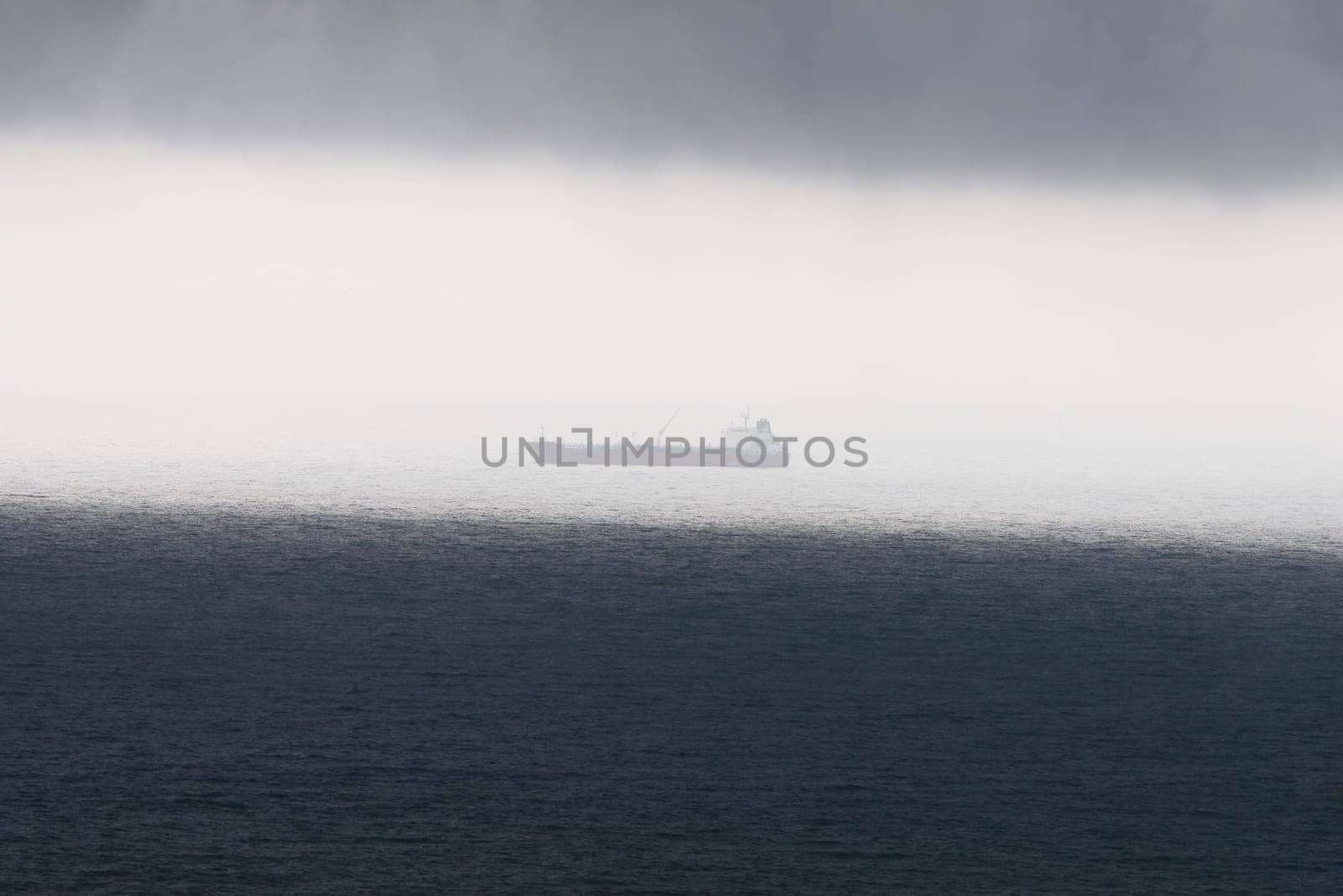 When suddenly a storm came up,it simply had to be recorded. The ship is still in the sunshine,but the dark cloud cover is approaching and darkening everything...