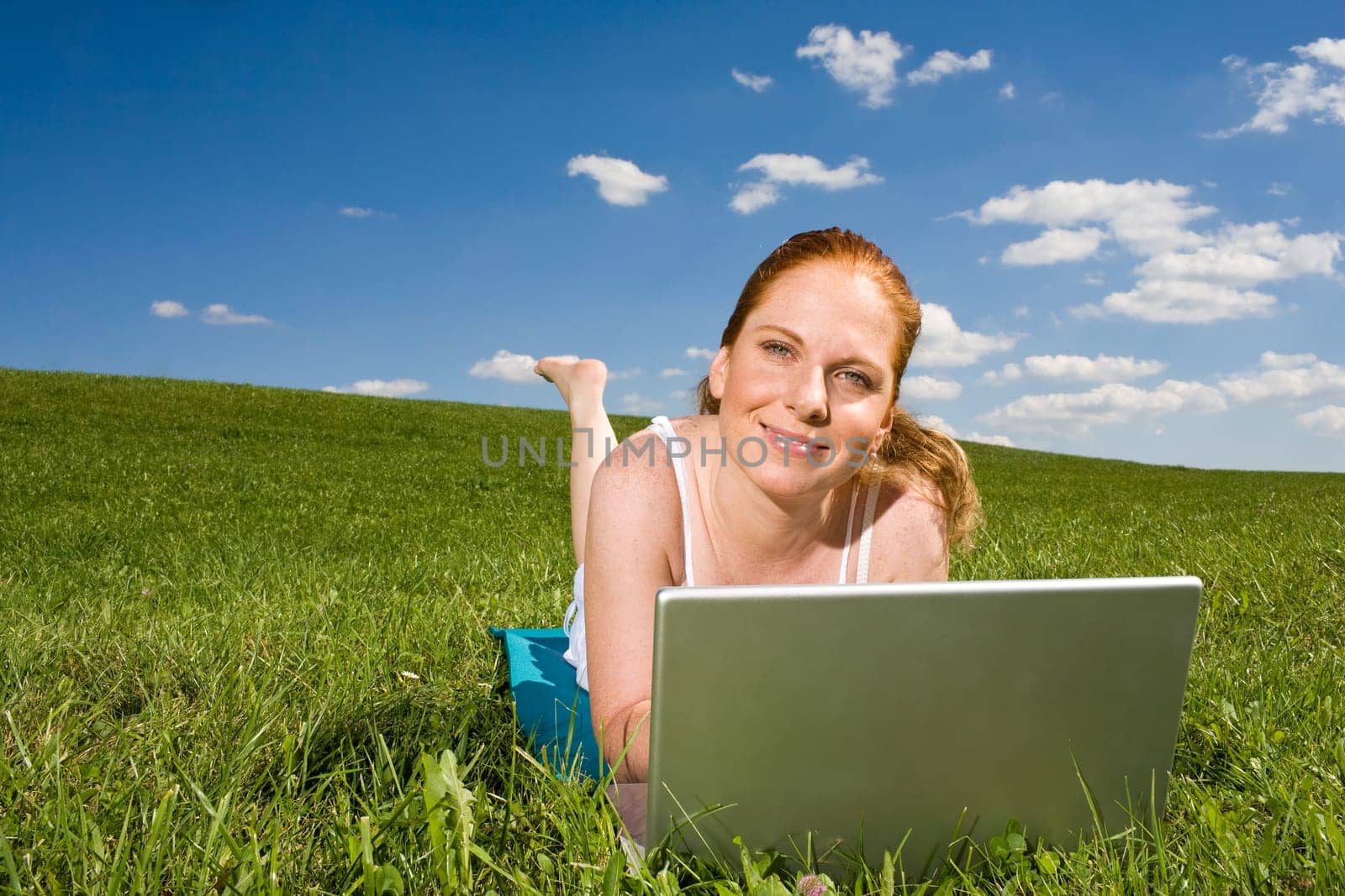 In the grass at the notebook