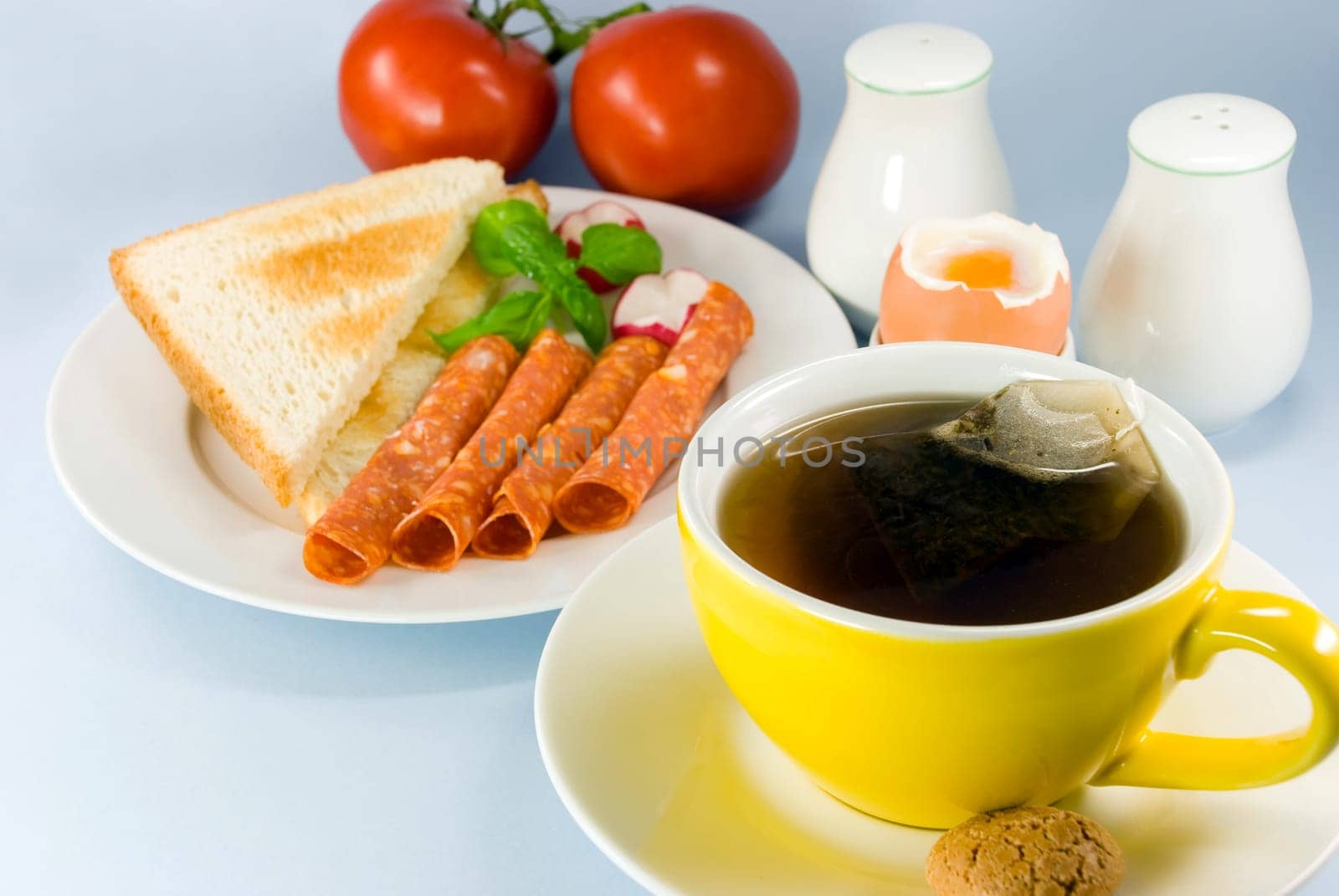 Breakfast with sausage ,toast,butter ,egg