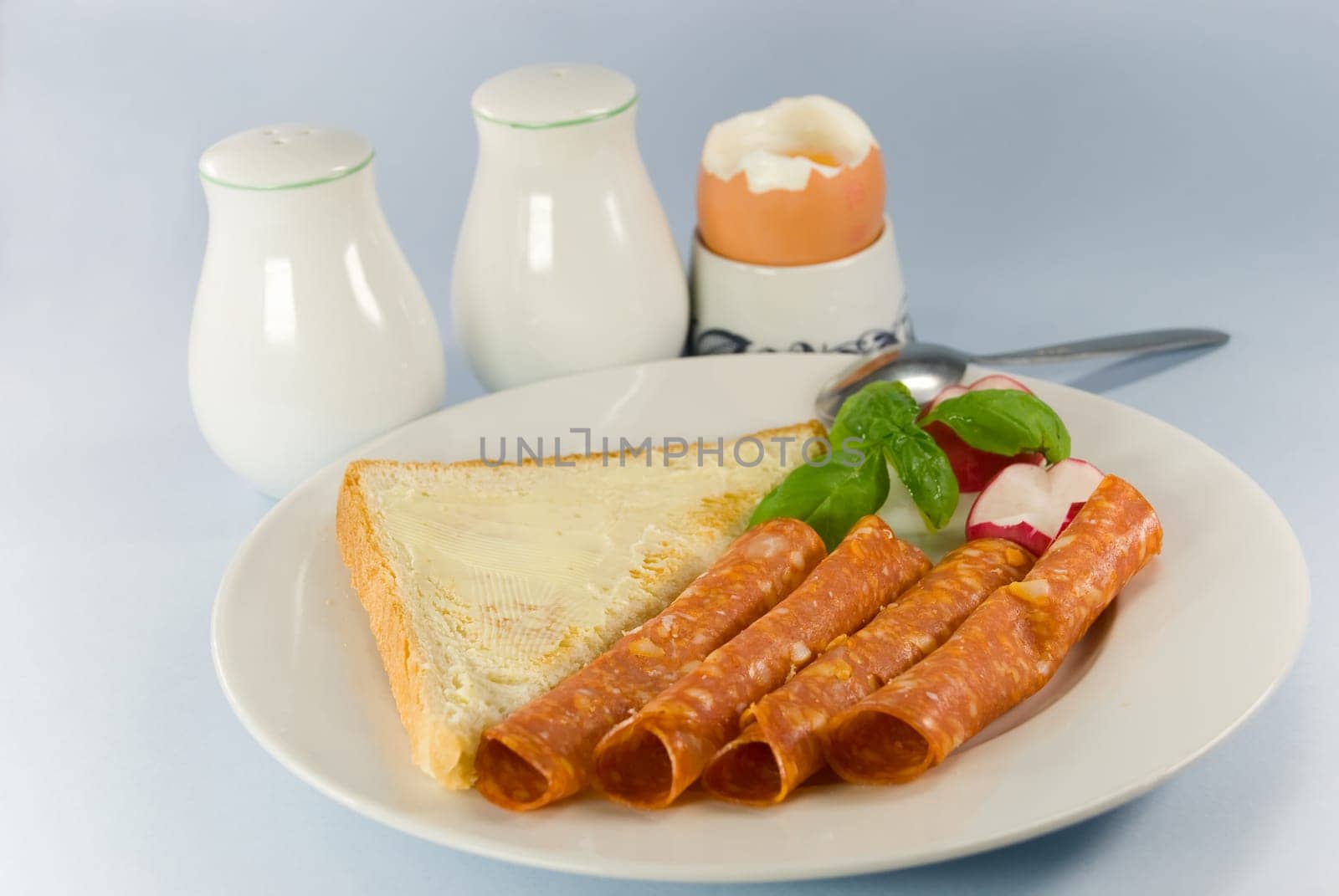 Breakfast with sausage ,toast,butter ,egg 2