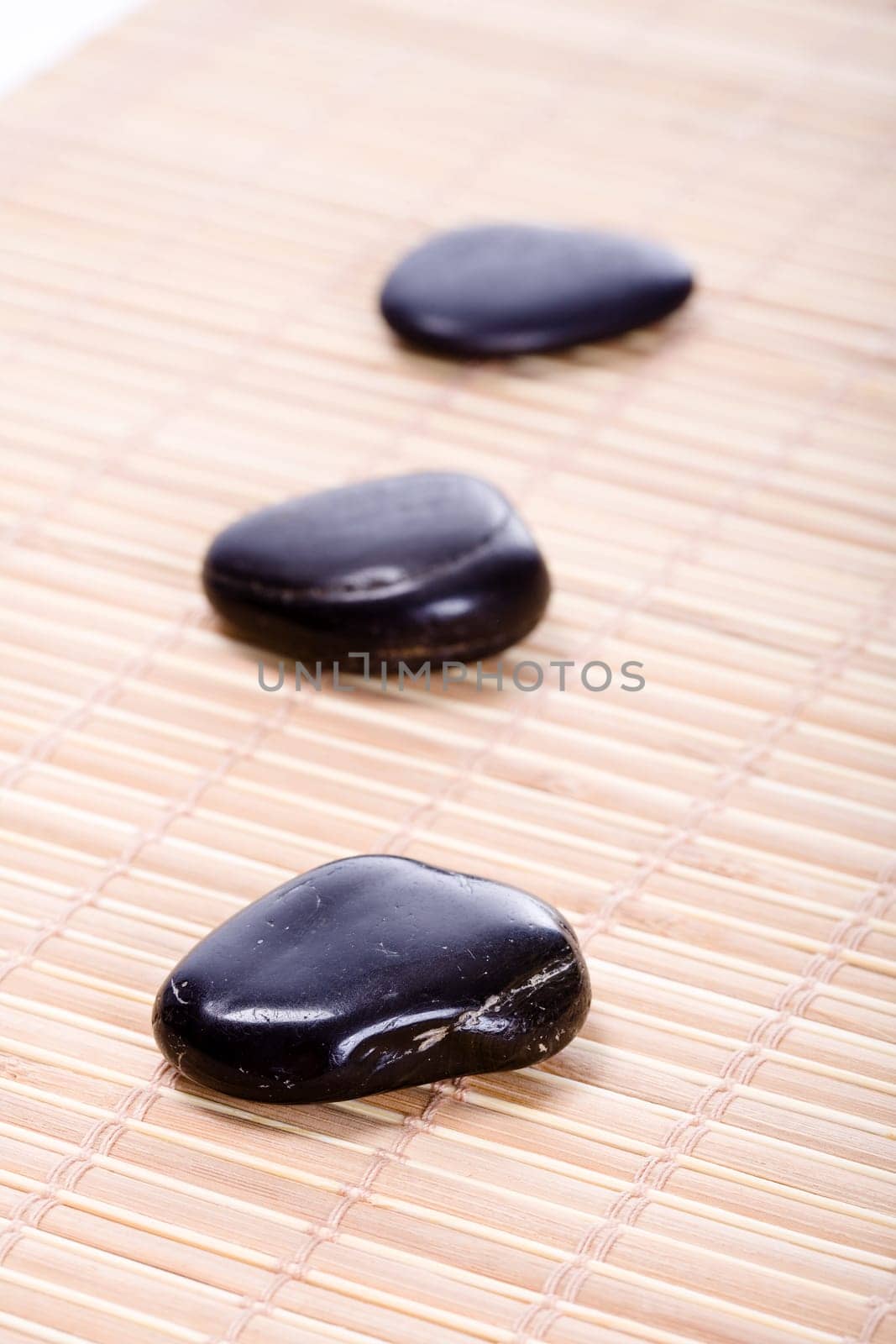 Three Zen Stones on Bamboo Mat II