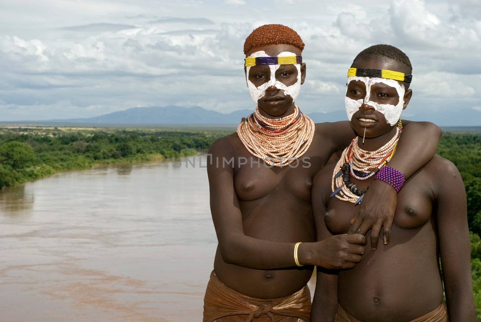 Karo girl at the Omo River in southern Ethiopia. The Karo tribe is threatened with extinction,with only 1500 members left.