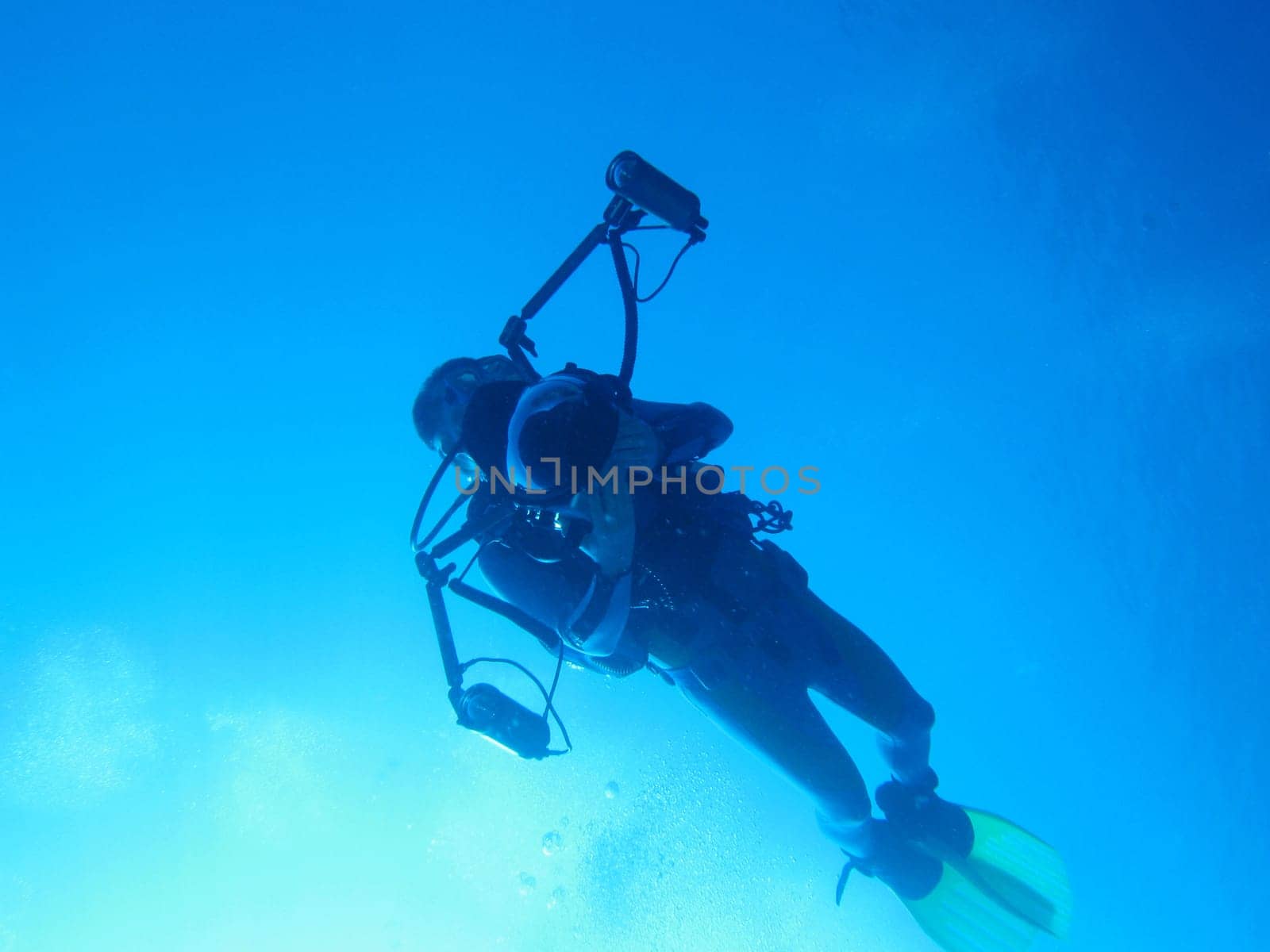 Underwater photographer with a fisheye attachment.