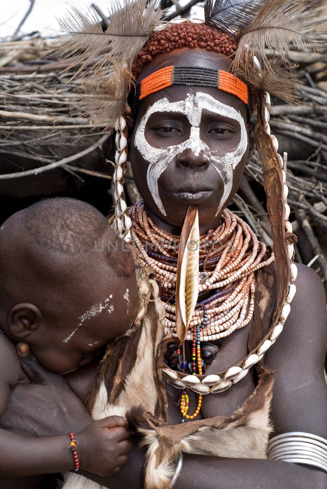 Plaid woman with baby,southern Ethiopia