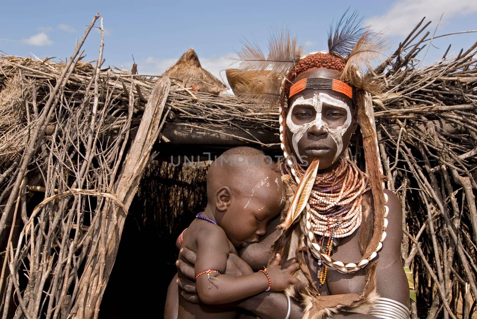 Plaid woman with baby,southern Ethiopia