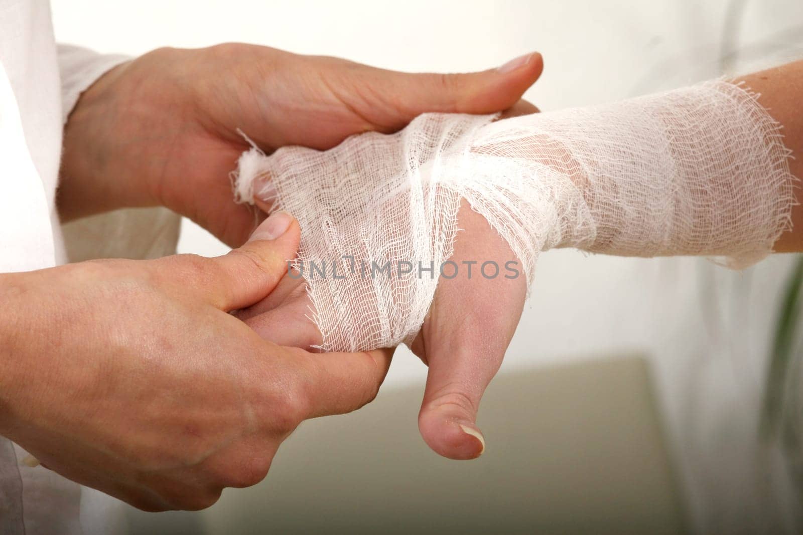 Put the bandage on the wrist