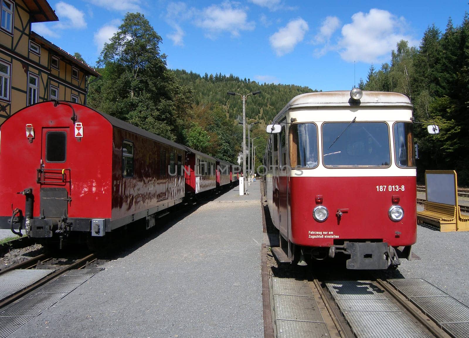 Encounter between a steam locomotive of the Harz narrow-gauge railway and a railcar.