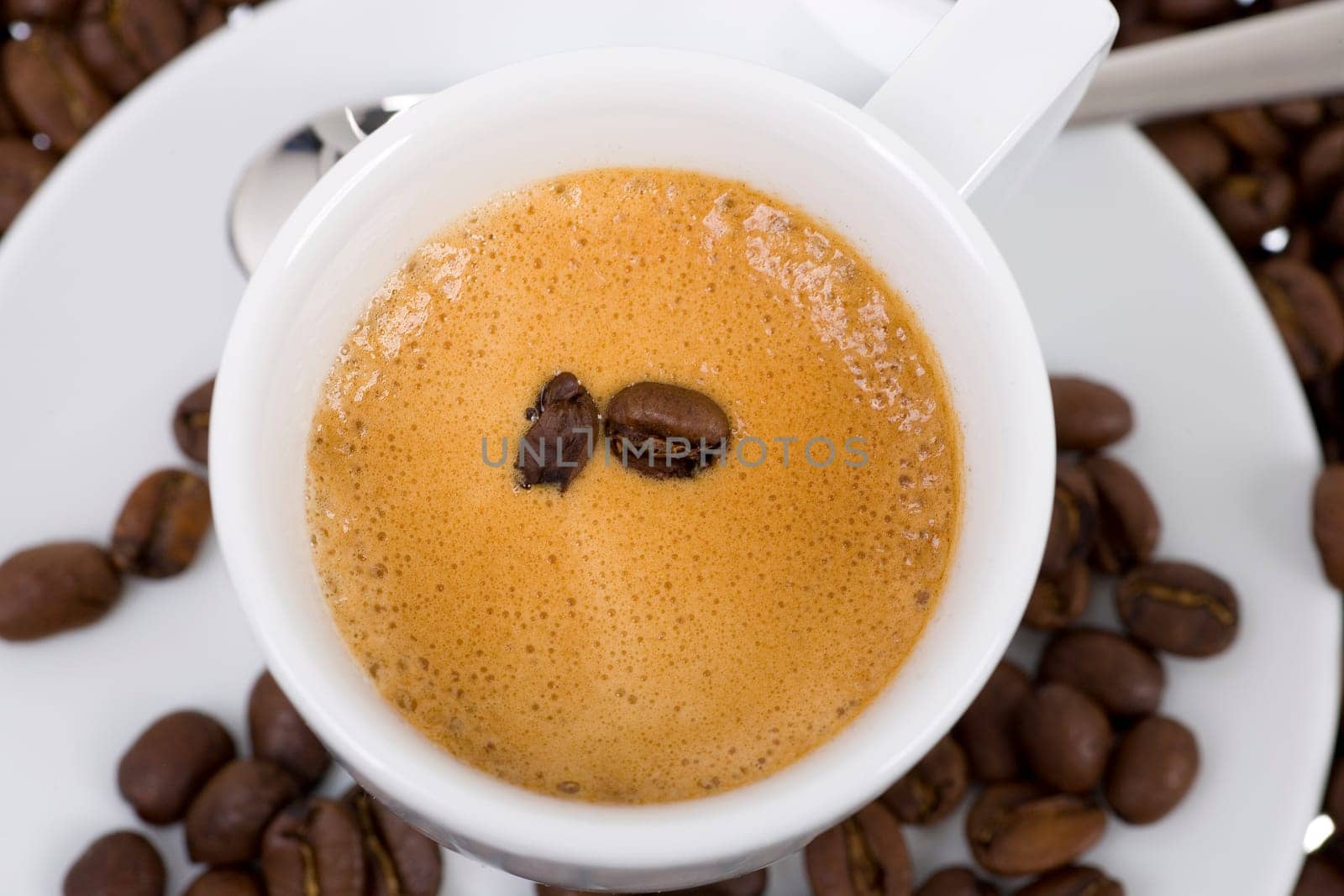 Coffee beans swimming in espresso
